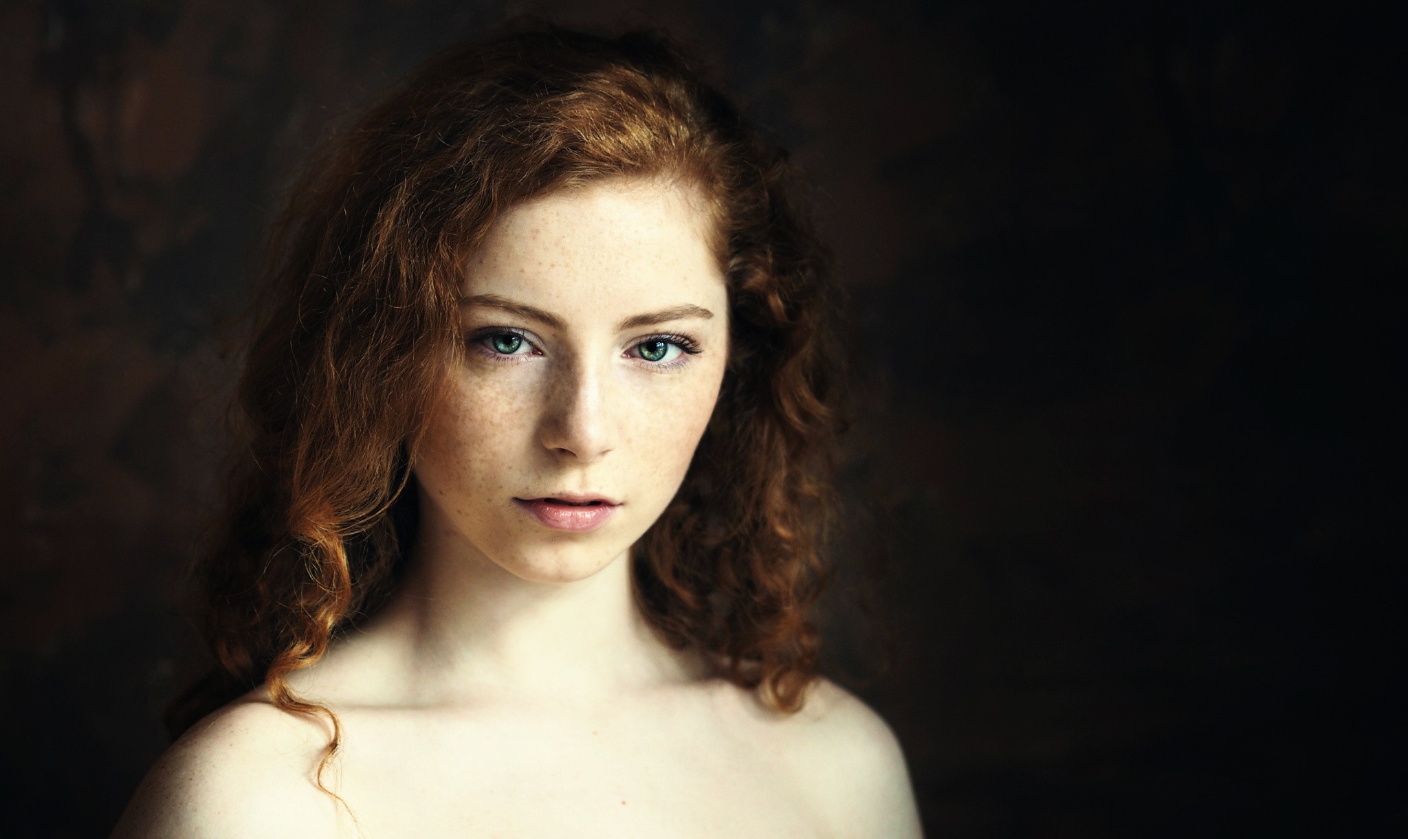 Portrait of a young woman with red hair and freckles HD Wallpaper