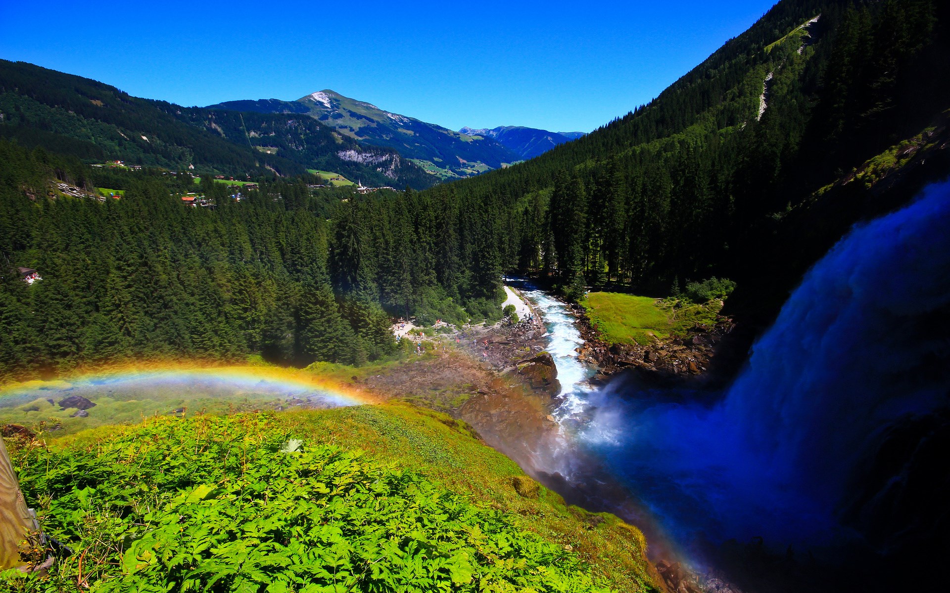 Waterfall with Rainbow and Forested Mountains HD Wallpaper