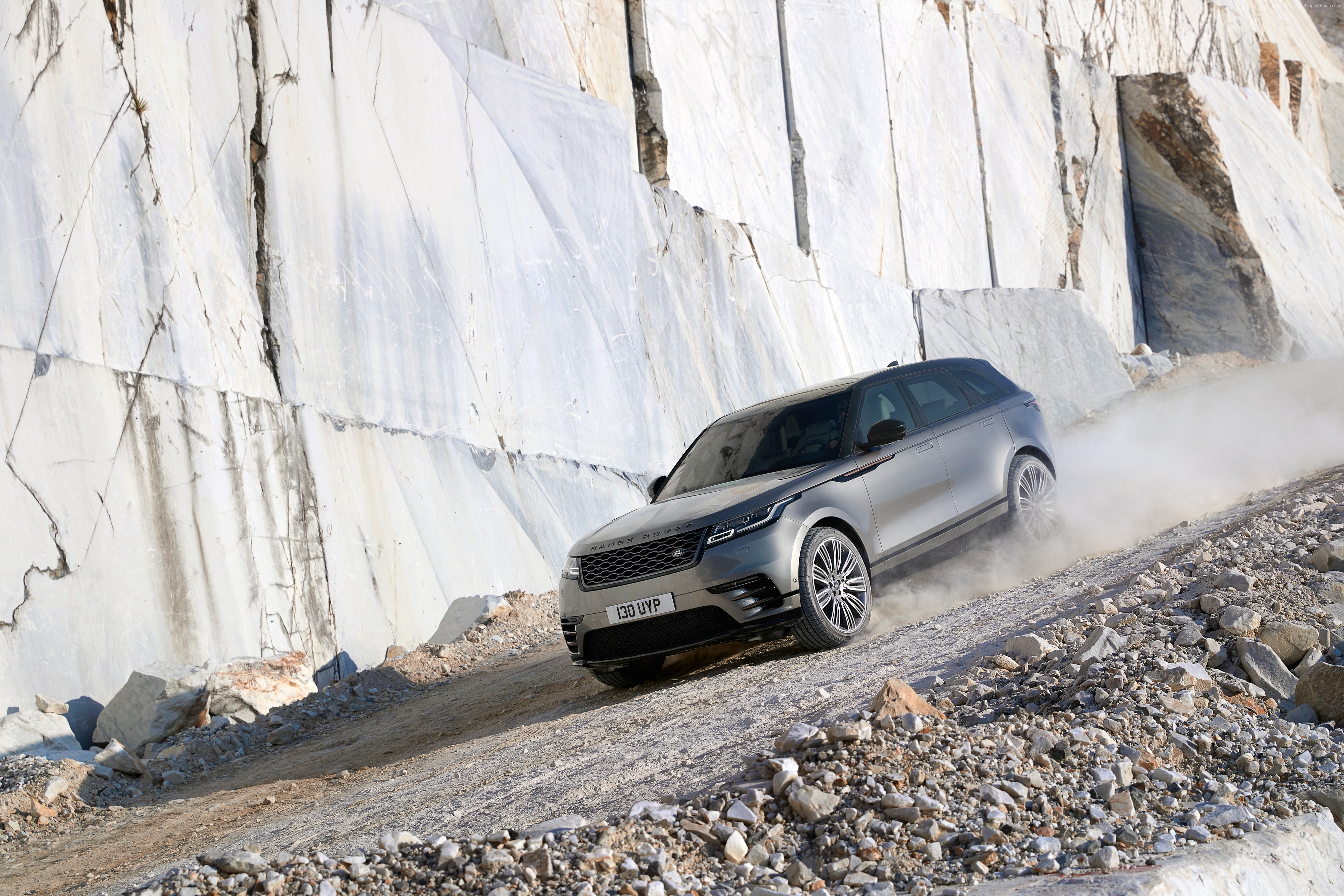 Range Rover Velar driving on a dirt road HD Wallpaper