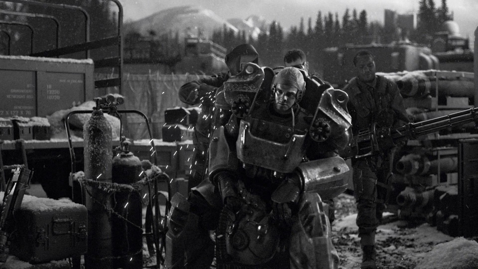 Soldiers in power armor with heavy weapons in a snowy environment HD Wallpaper