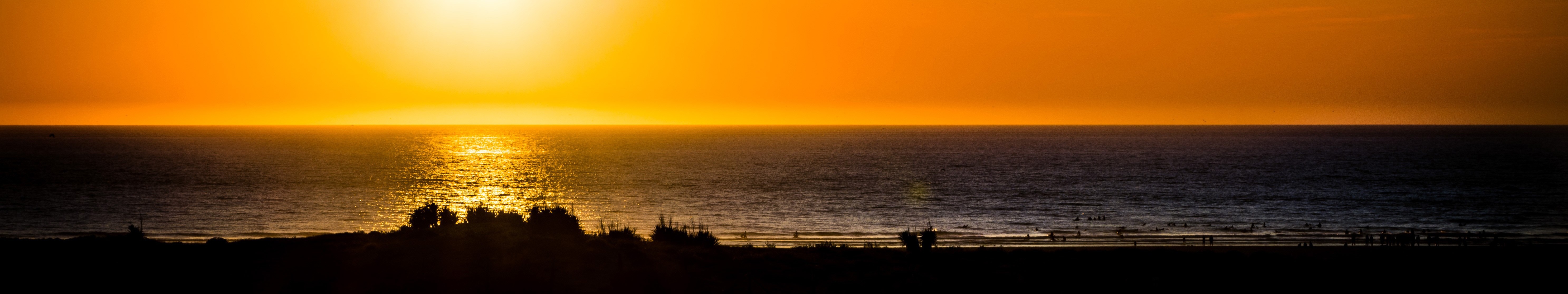Sunset over the ocean with reflection HD Wallpaper