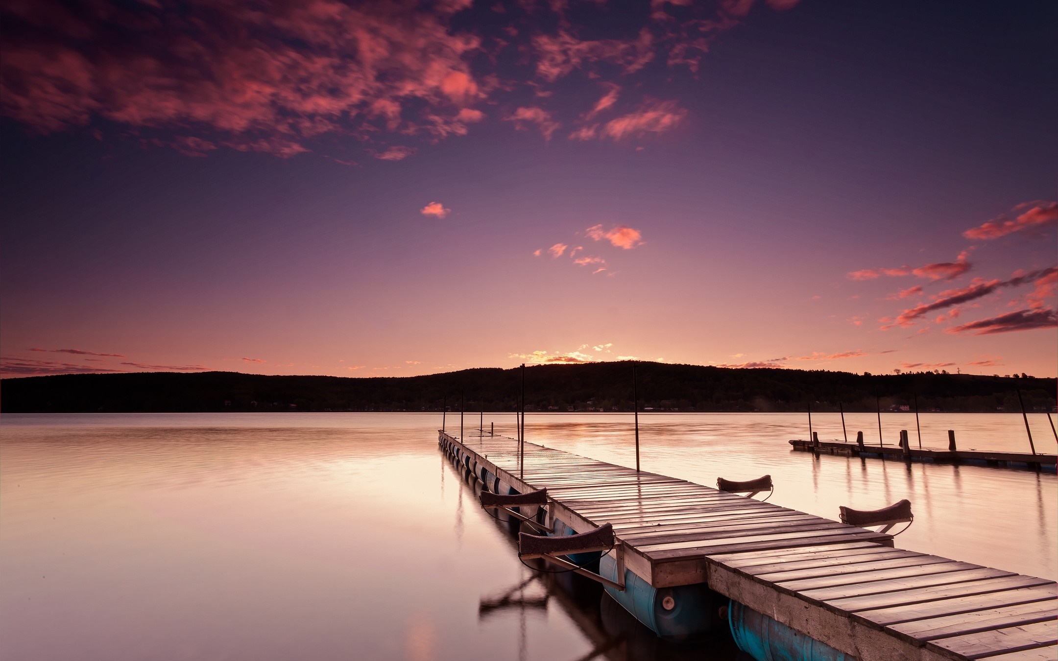 Wooden pier on a lake at sunset with colorful clouds HD Wallpaper