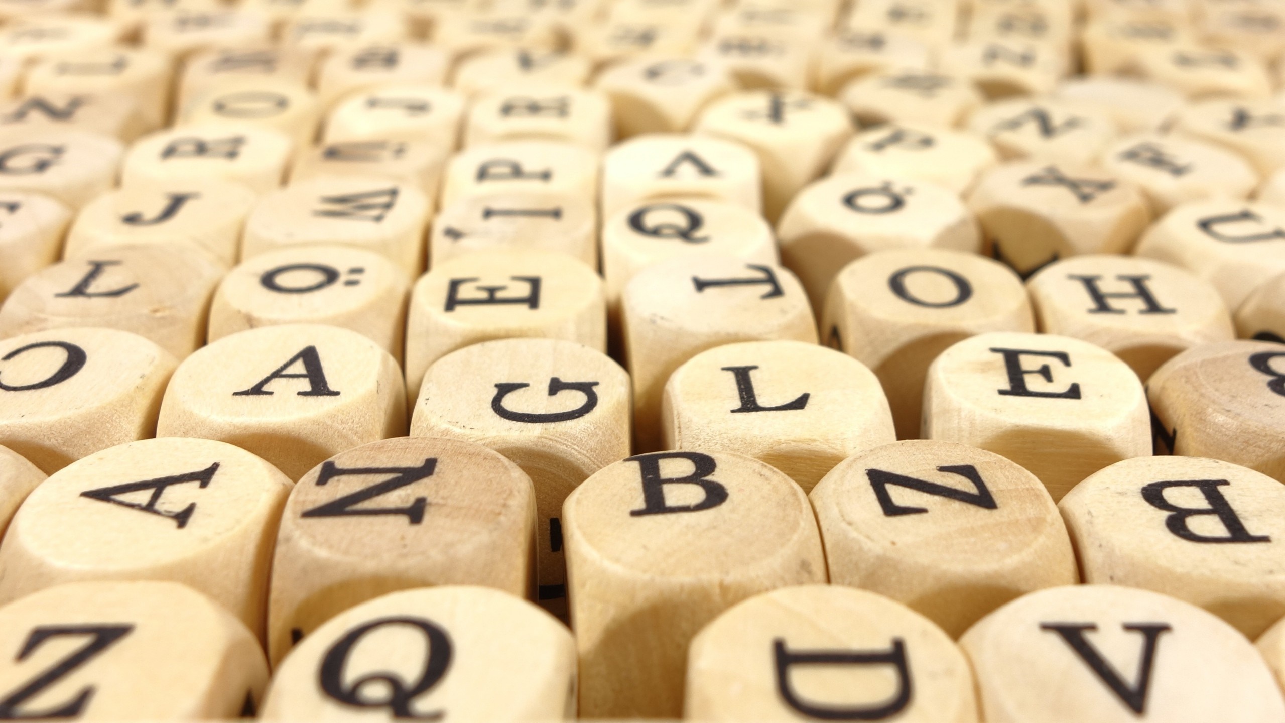 Close-up of wooden letter blocks HD Wallpaper
