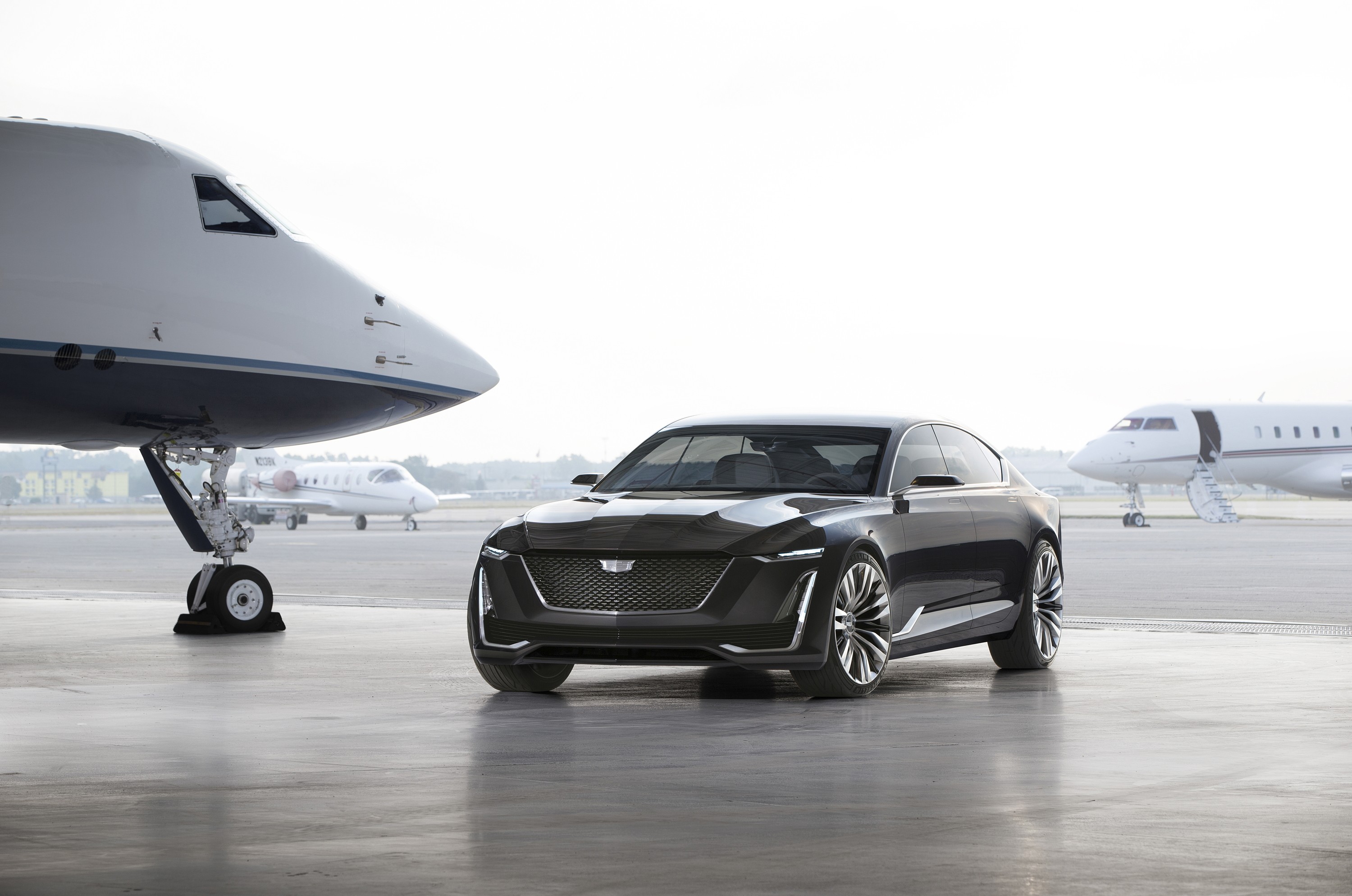 Cadillac Escala concept car on tarmac with private jets HD Wallpaper