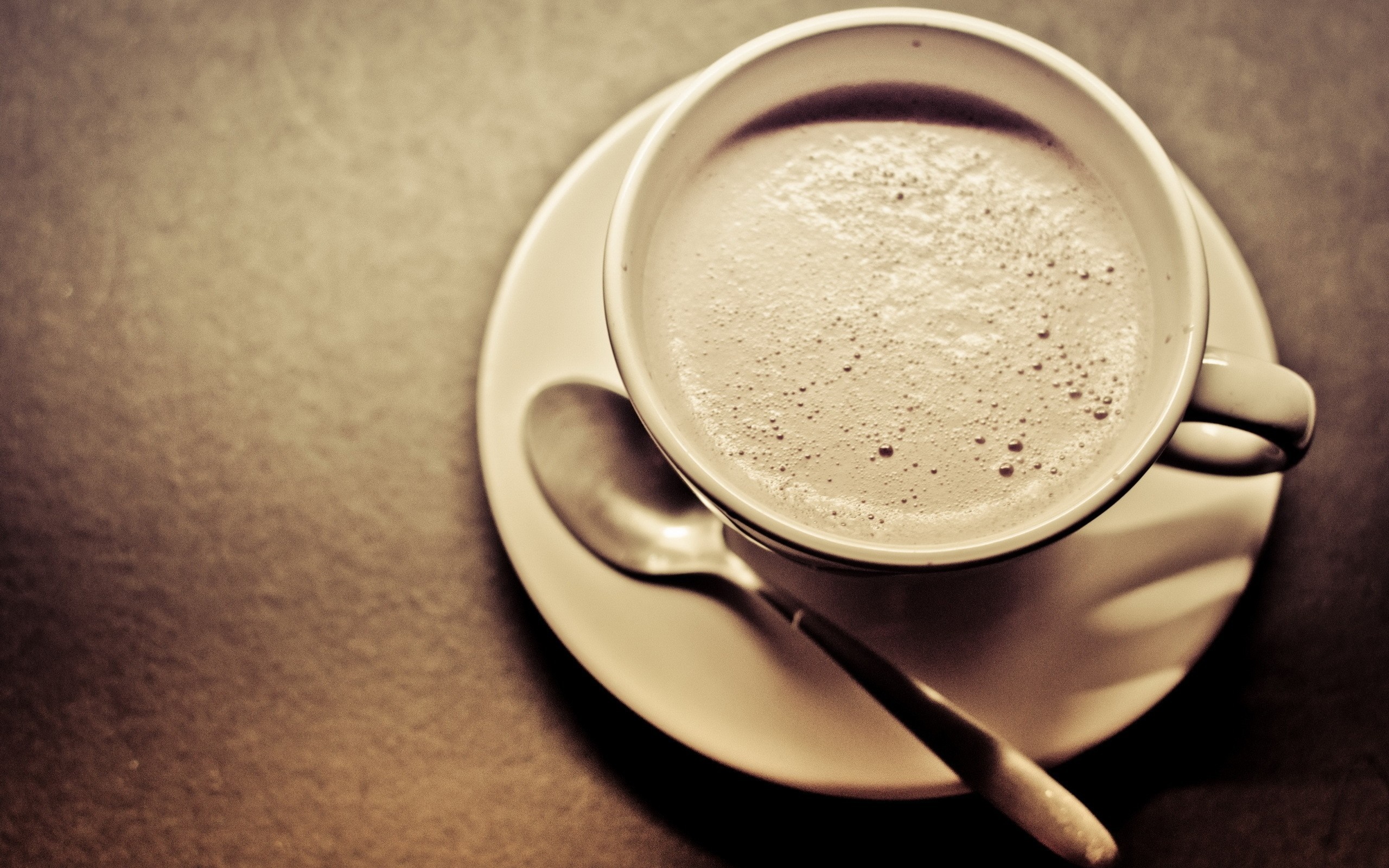 Close-up of a coffee cup with a spoon HD Wallpaper
