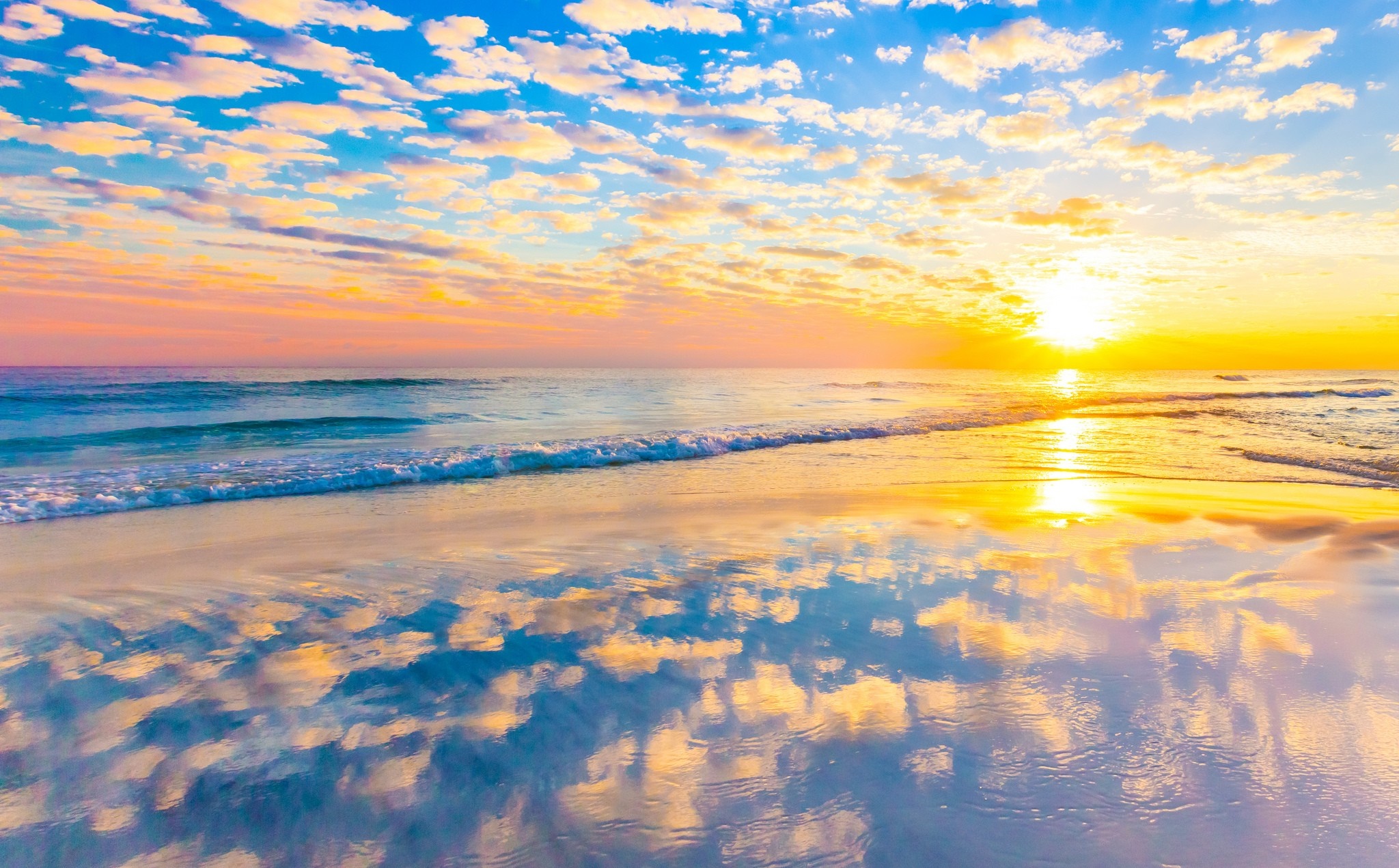 Sunset over the ocean with colorful clouds and reflection HD Wallpaper