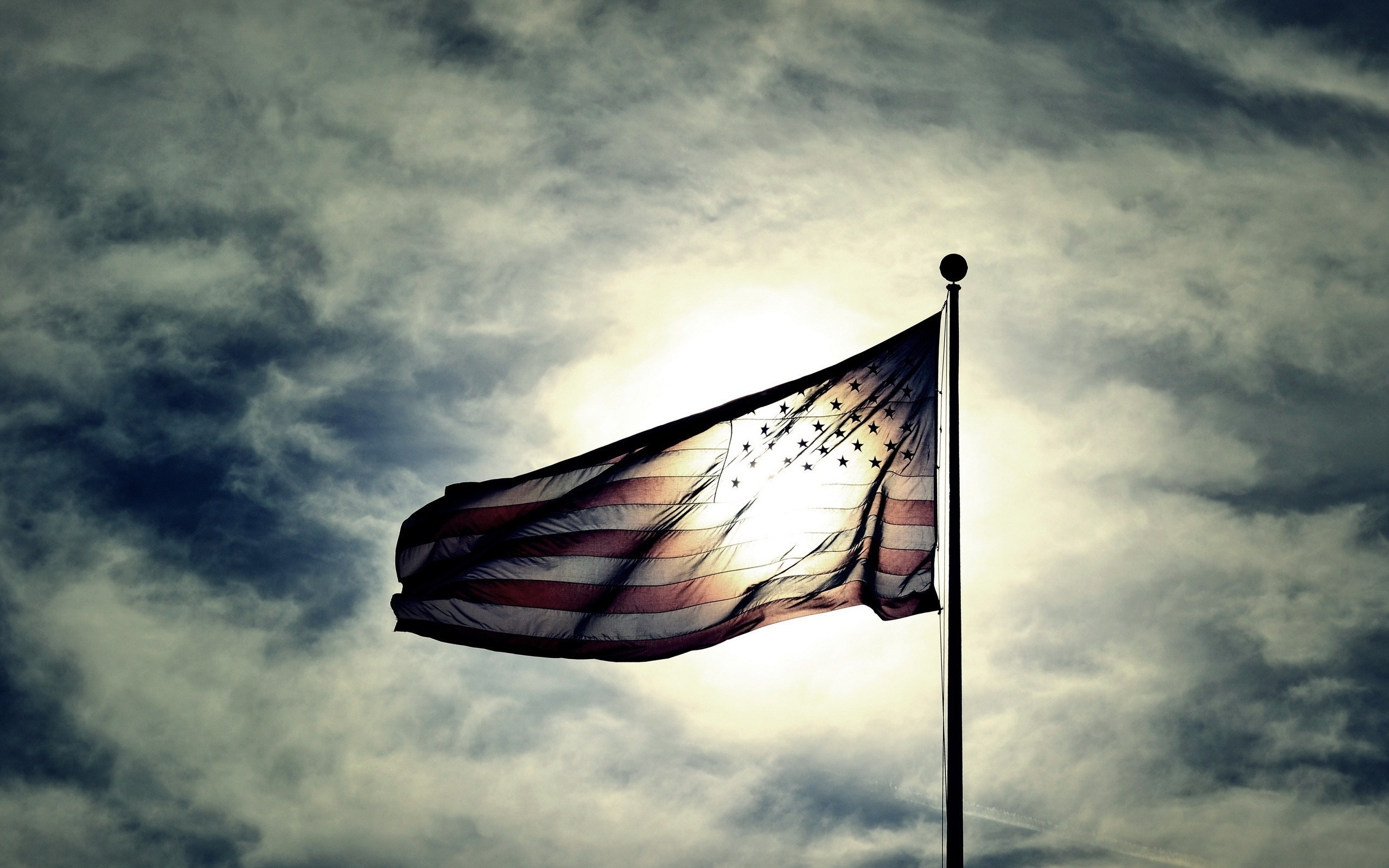 American flag waving in the sky with sunlight HD Wallpaper