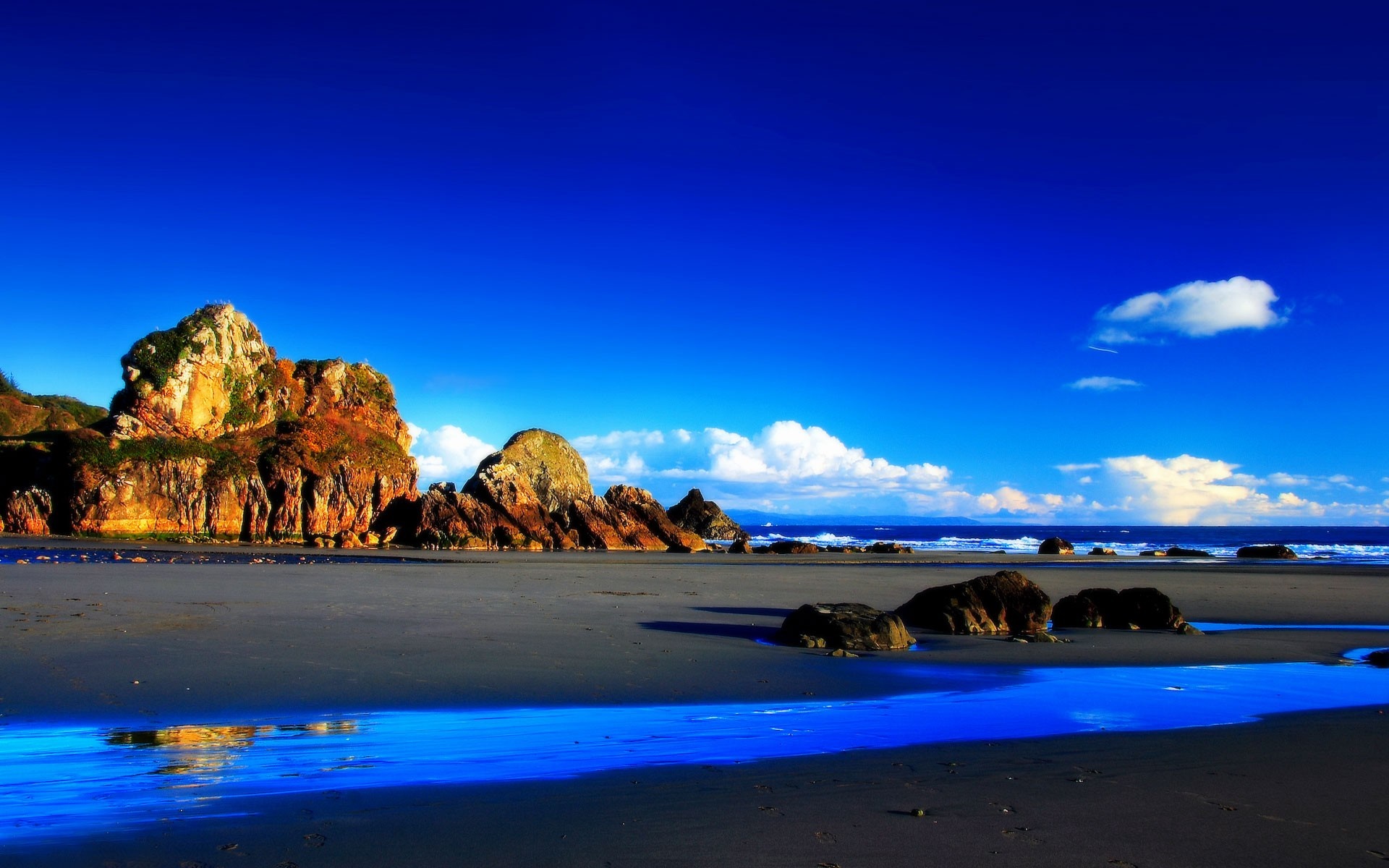 Rocky coast with blue sky and ocean HD Wallpaper
