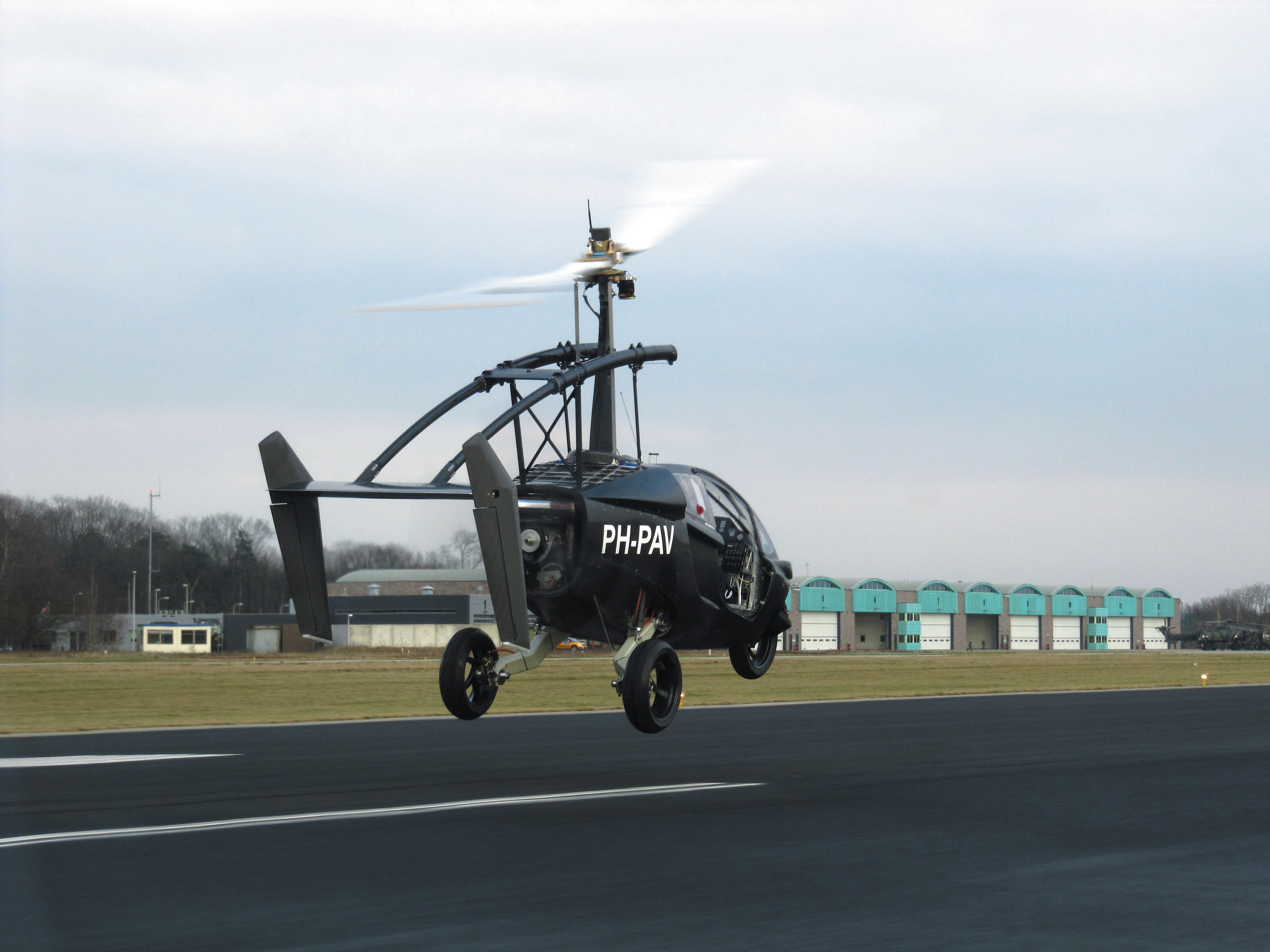 PAL-V ONE flying car taking off from runway HD Wallpaper