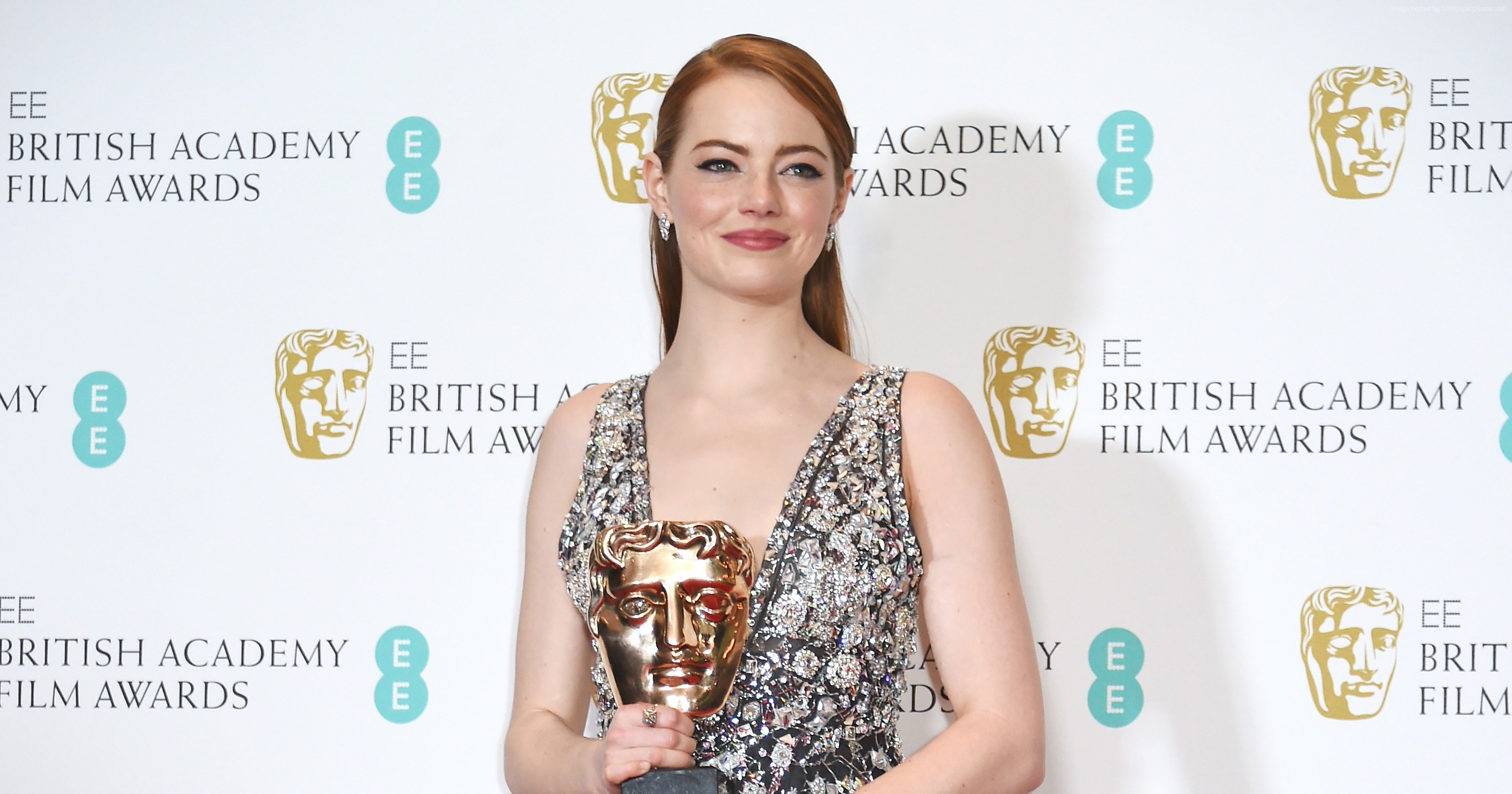 Emma Stone holding BAFTA award HD Wallpaper