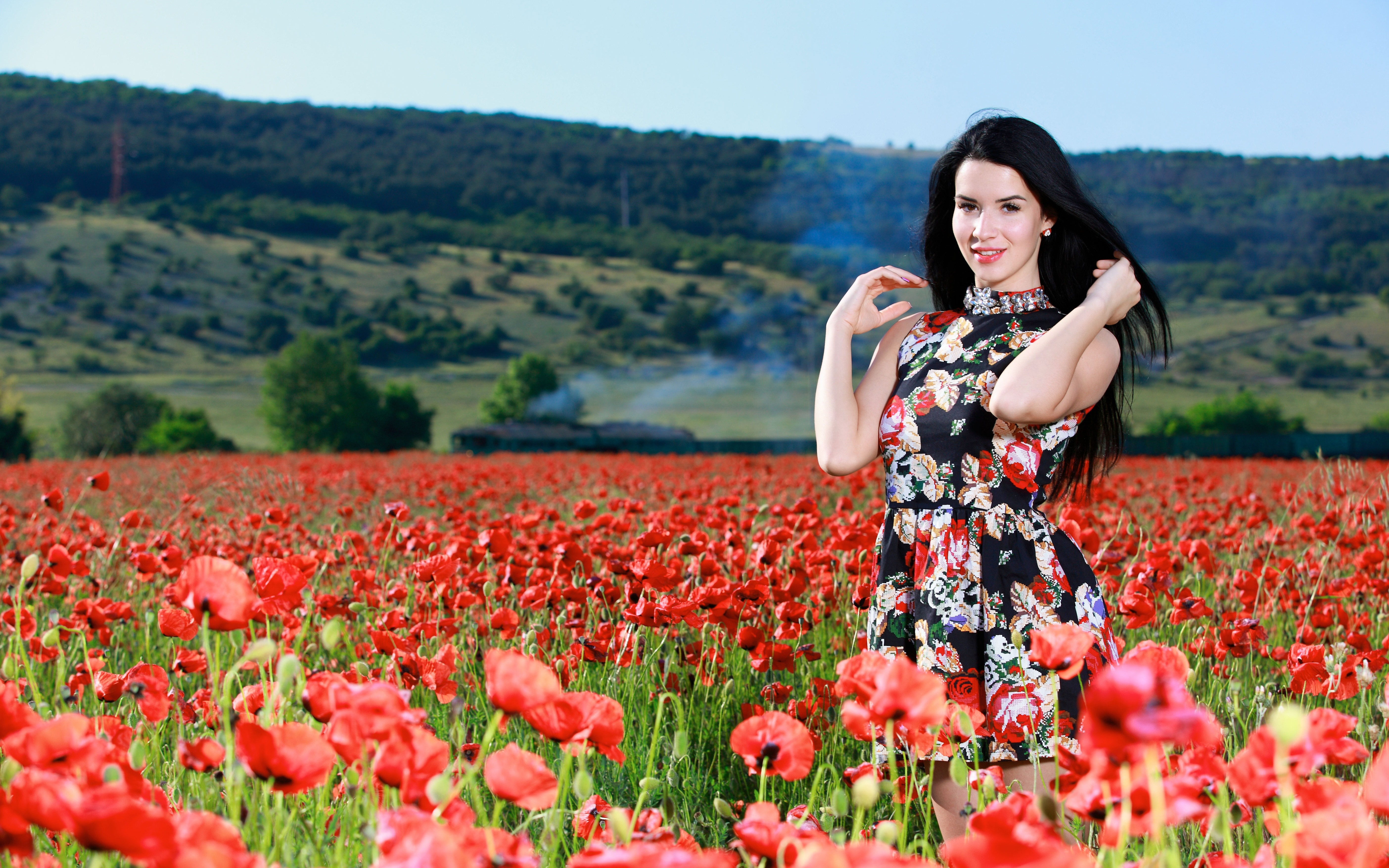 Woman in floral dress in a poppy field HD Wallpaper