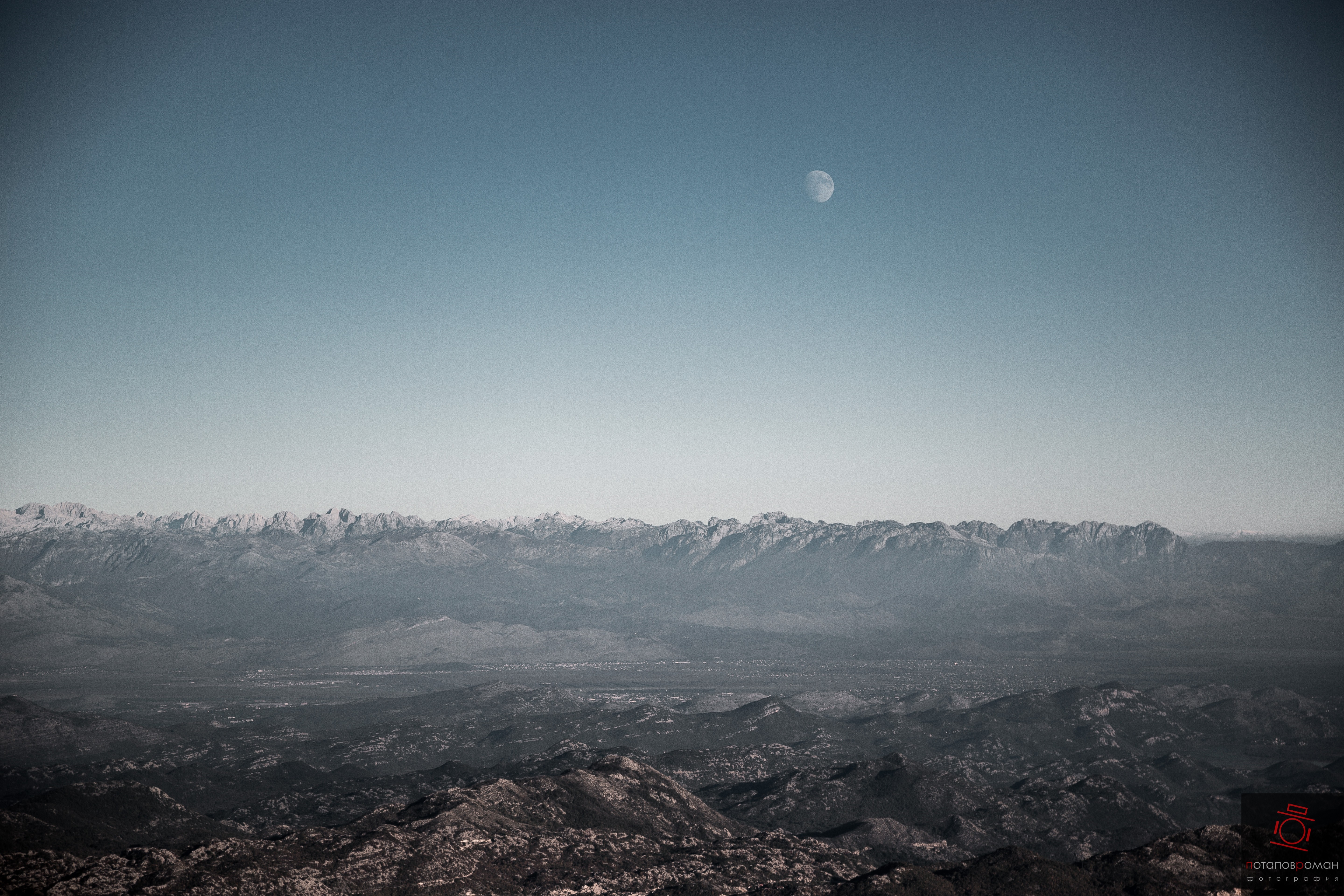 Moon over mountain range and foothills HD Wallpaper