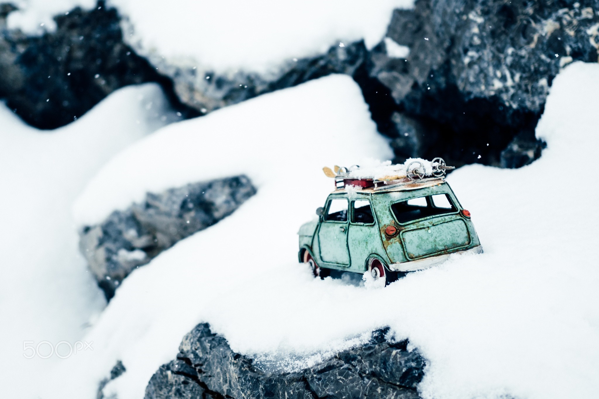 Toy car with skis on roof in snow HD Wallpaper