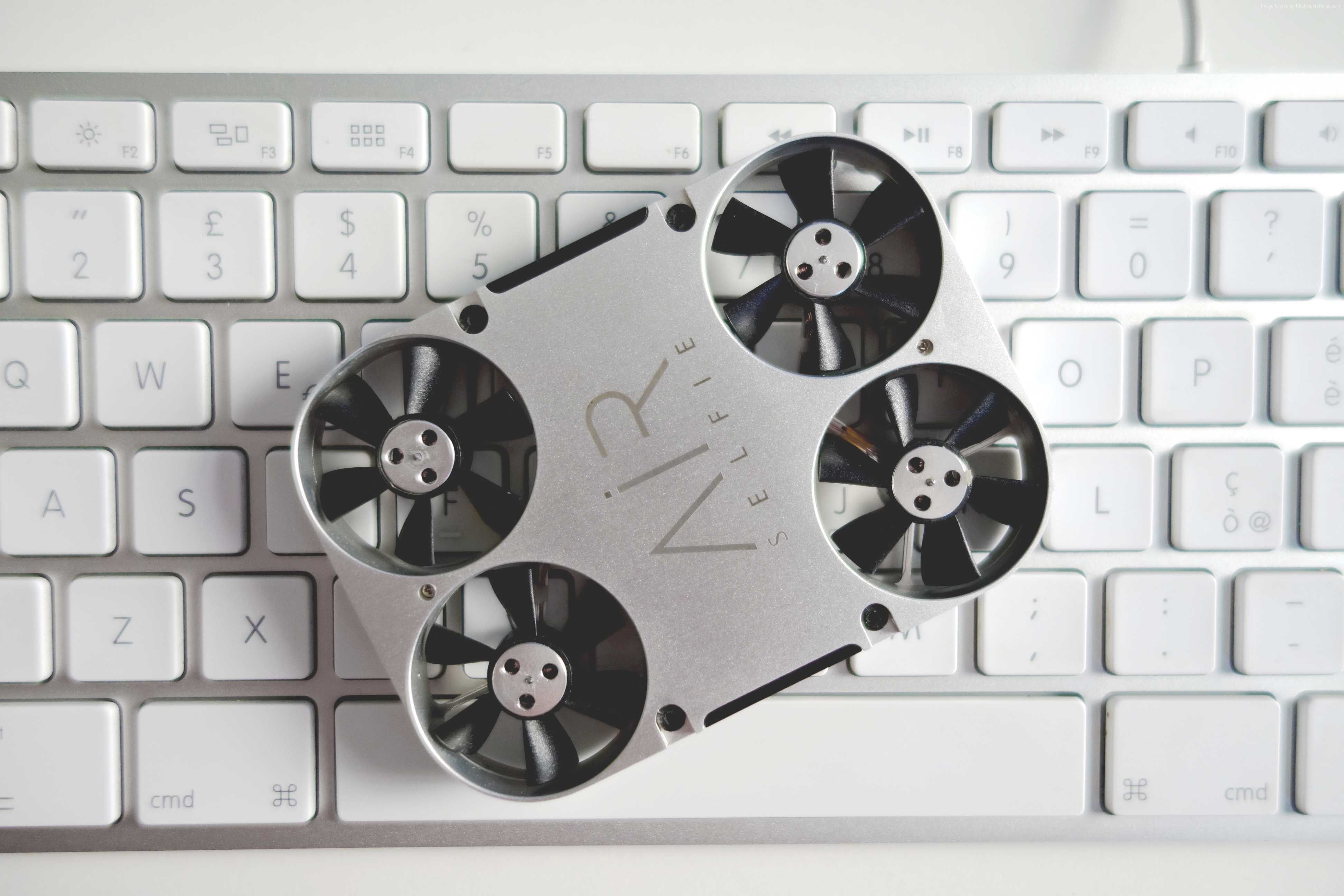 AirSelfie drone on a keyboard HD Wallpaper