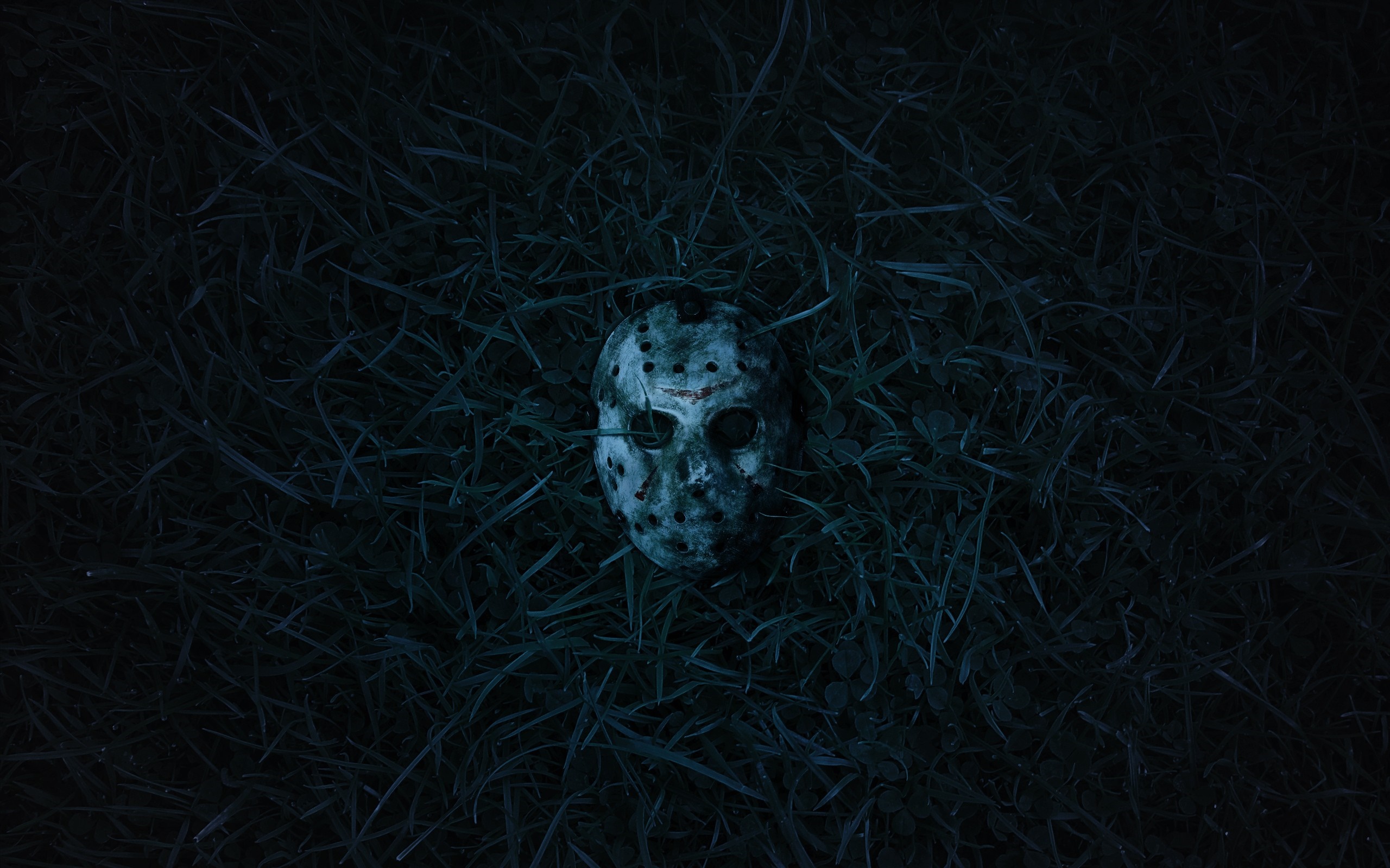 Jason Voorhees mask in grass HD Wallpaper