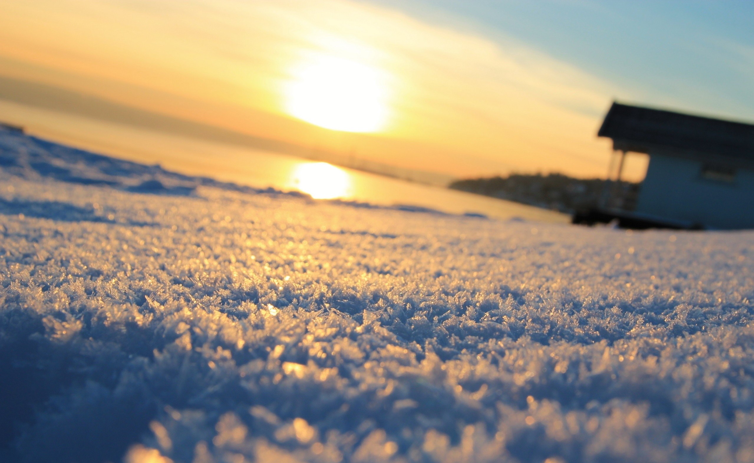 Snowy landscape at sunset with a house HD Wallpaper