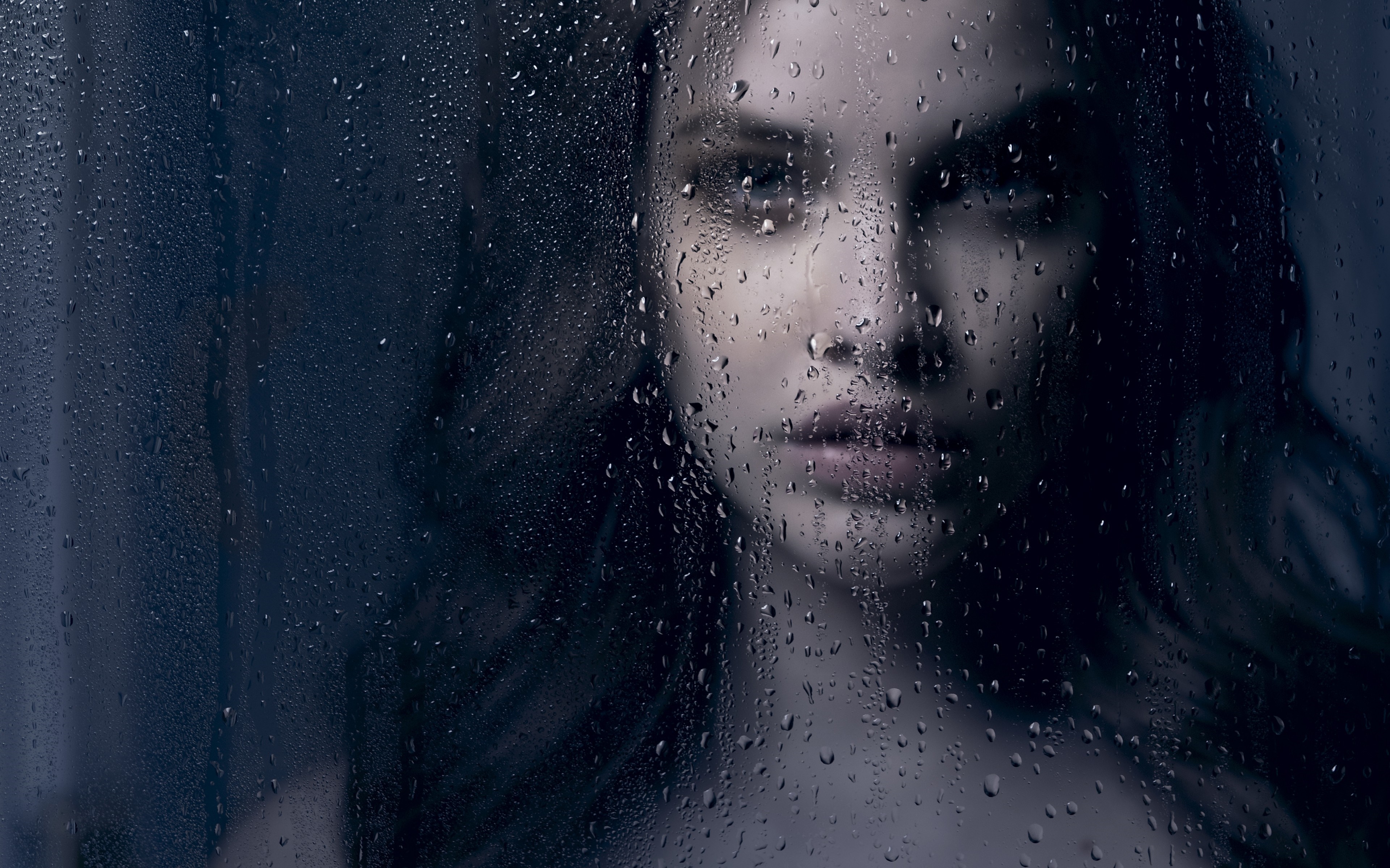 Woman behind a wet glass pane HD Wallpaper