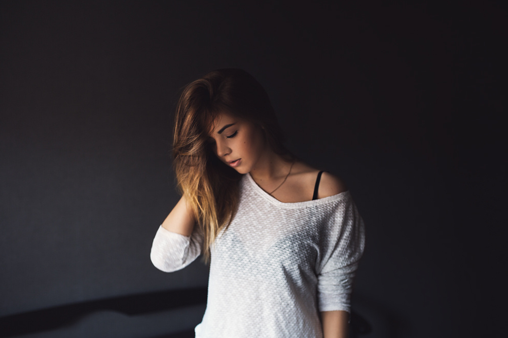 Woman with long brown hair wearing a white sweater HD Wallpaper