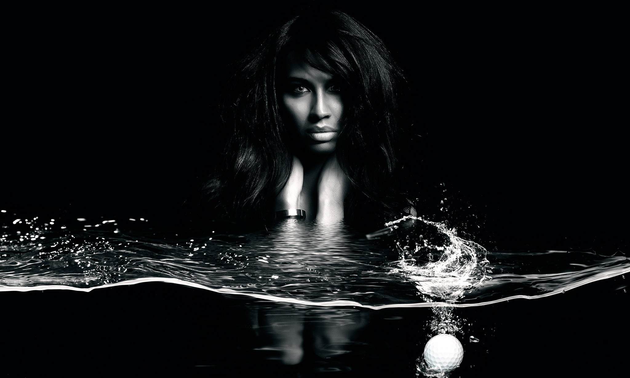 Woman in water with golf ball splash HD Wallpaper