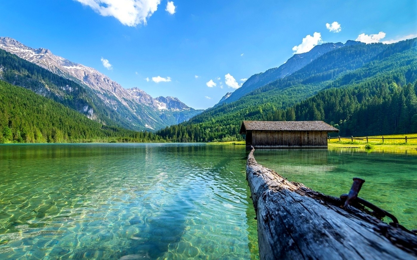 Wooden boathouse on a clear lake with mountains and forest HD Wallpaper