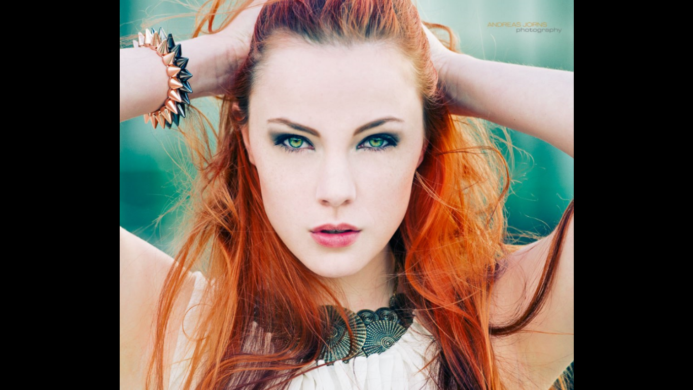 Woman with red hair and green eyes wearing a bracelet and necklace HD Wallpaper