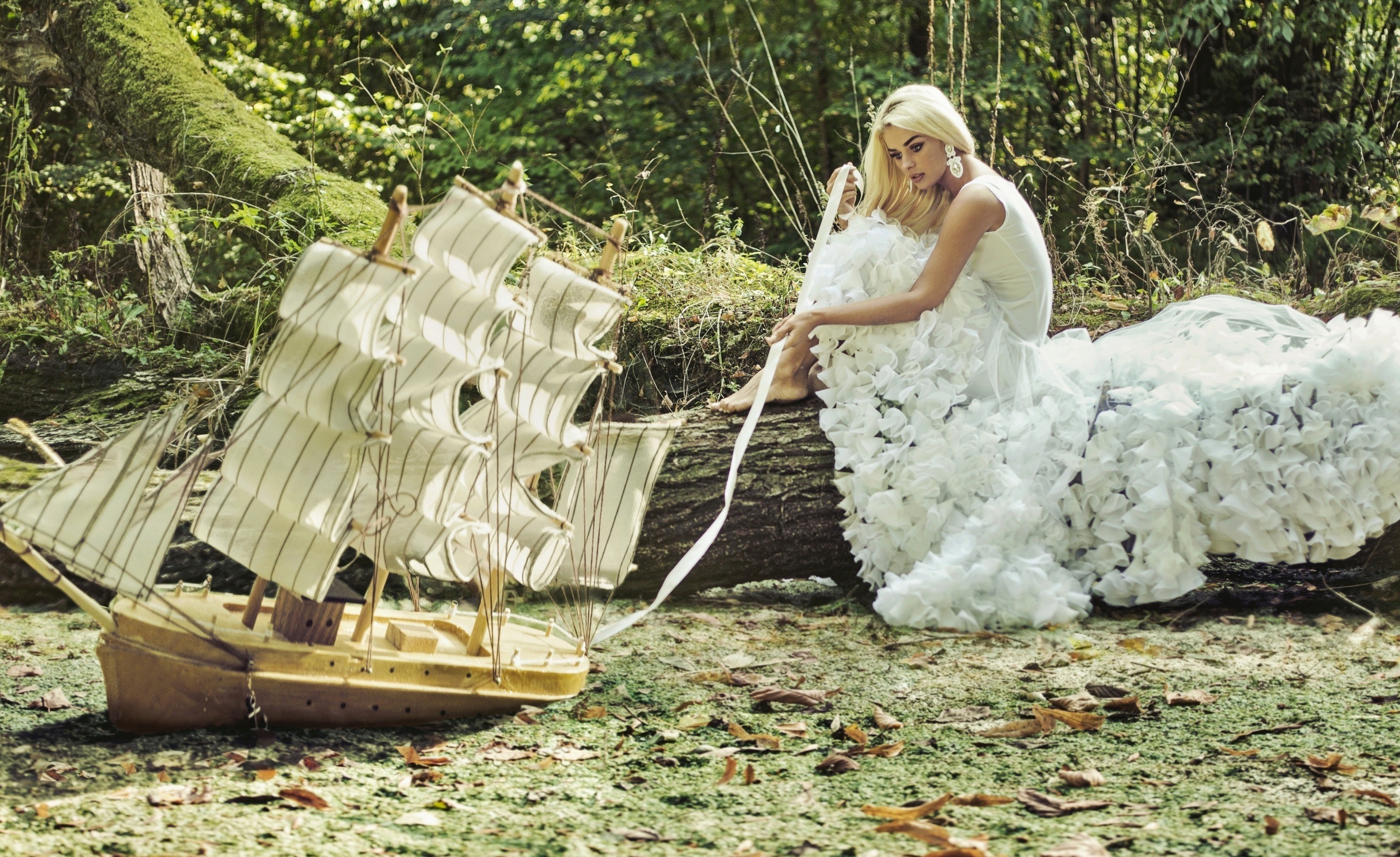 Woman in white dress with model ship in forest HD Wallpaper