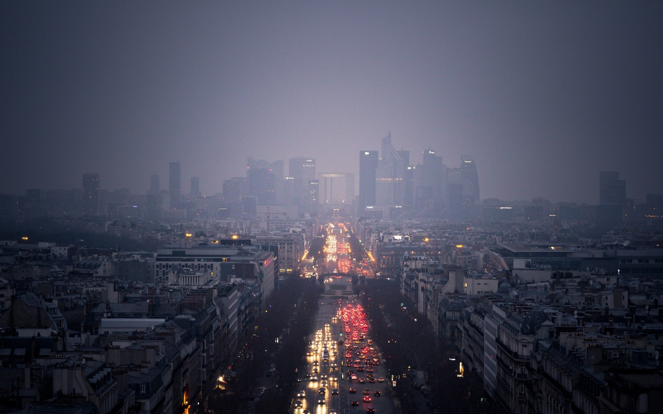 Paris cityscape with Grande Arche and traffic at dusk HD Wallpaper