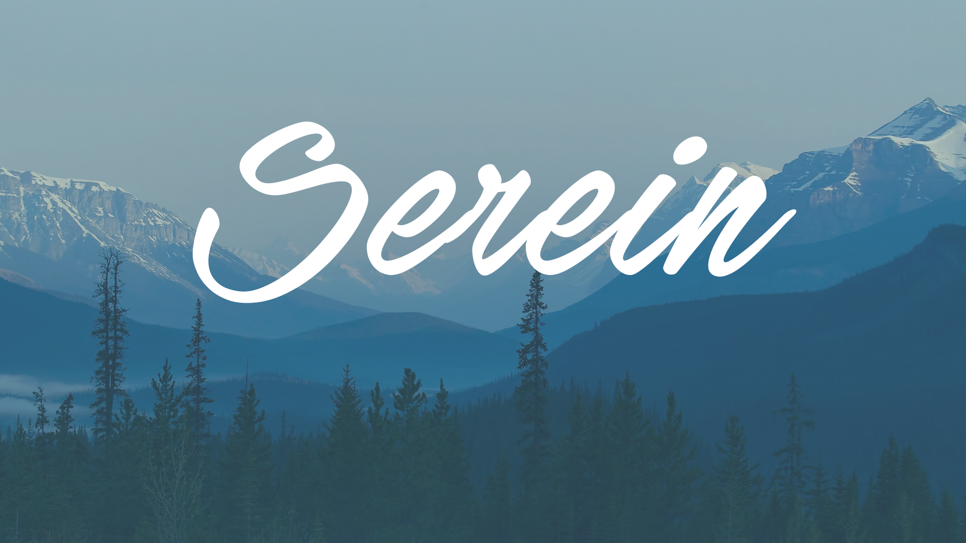 Serene mountains and forest with text HD Wallpaper