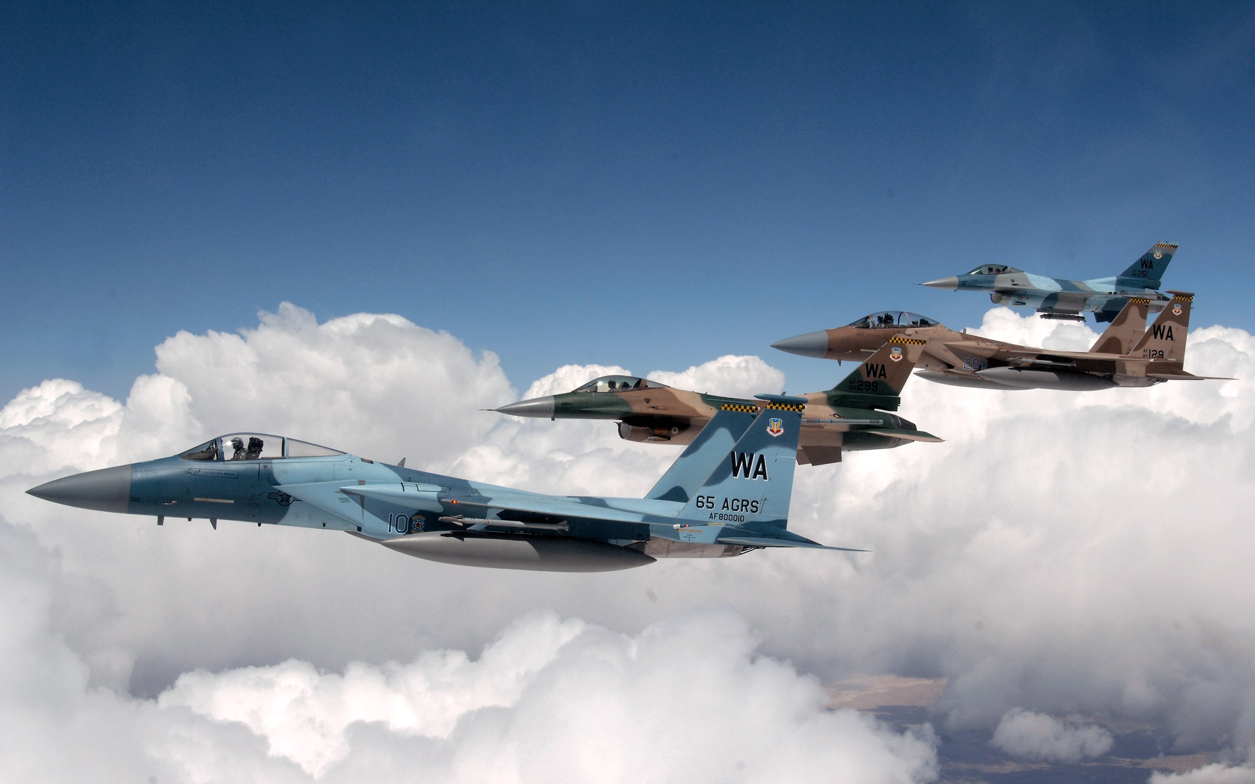 Four McDonnell Douglas F-15 Eagle fighter jets in formation HD Wallpaper