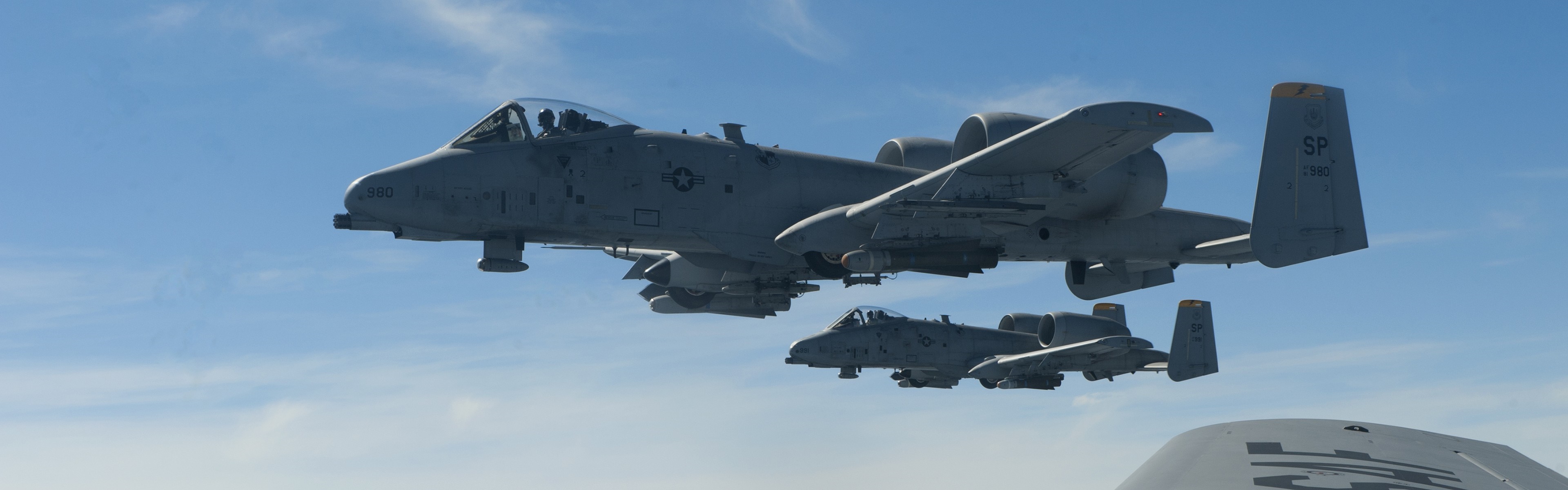 Two Fairchild Republic A-10 Thunderbolt II aircraft flying in formation HD Wallpaper
