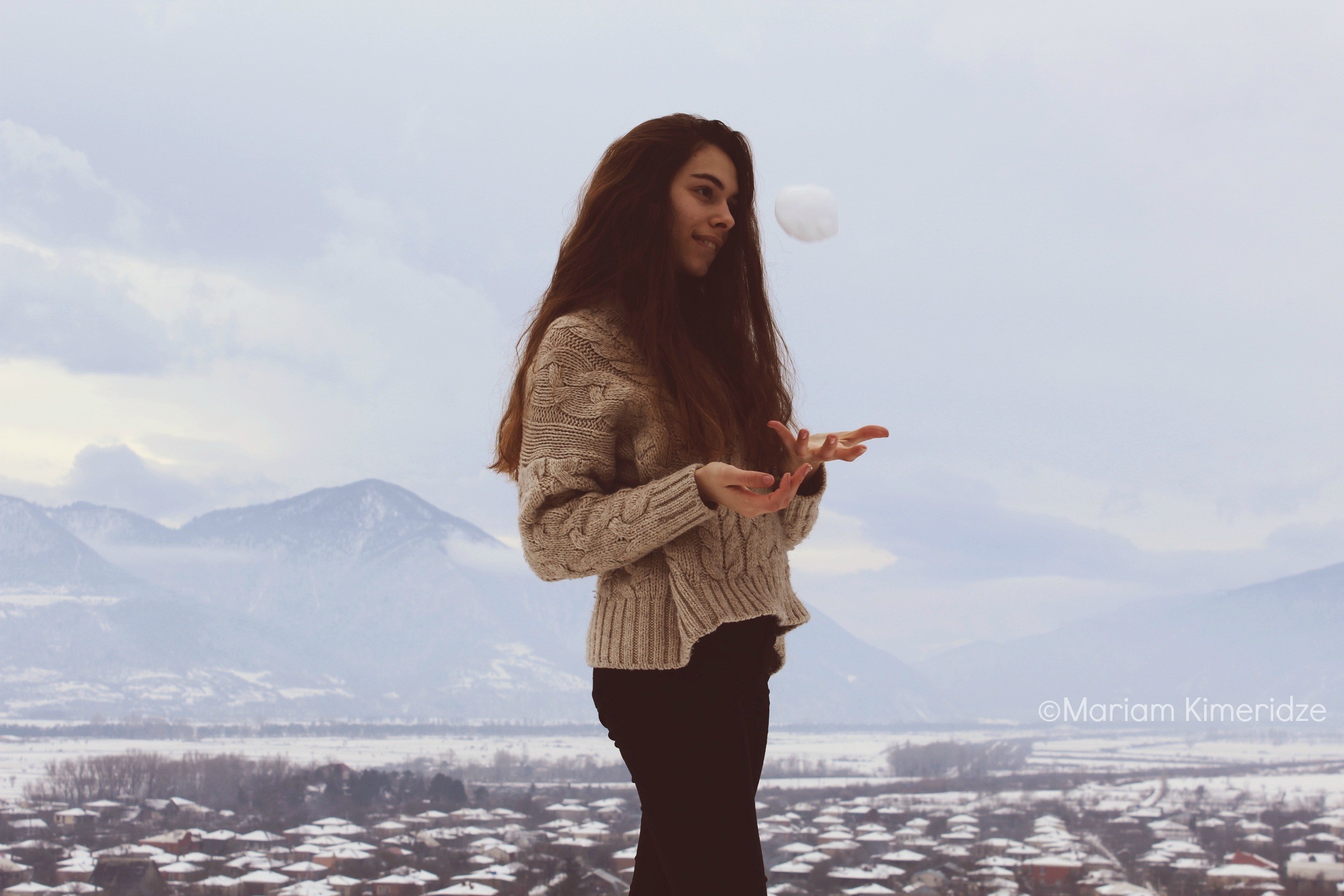 Woman throwing snowball in winter landscape HD Wallpaper