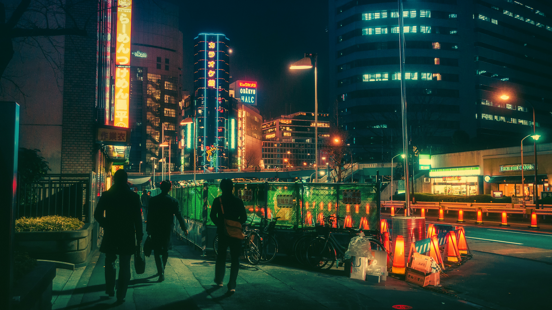 Nighttime street scene in Tokyo with neon lights and construction HD Wallpaper