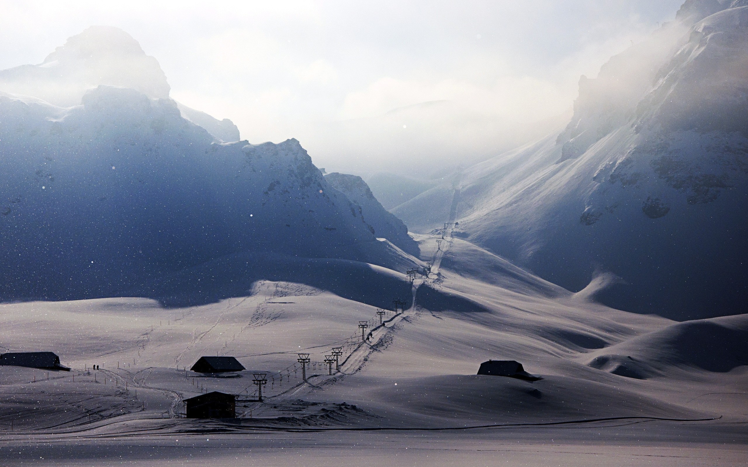 Snowy mountains with ski lifts and houses HD Wallpaper