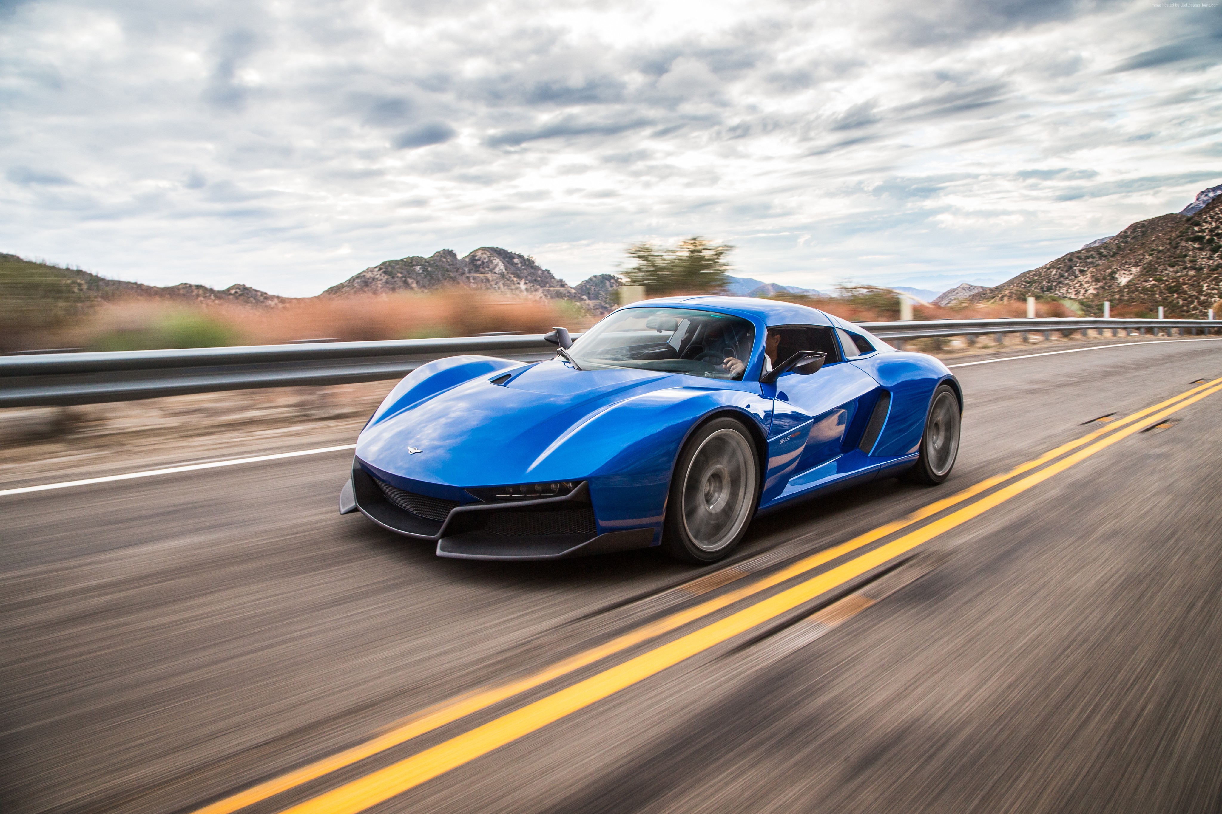 Blue Rezvani Beast Alpha driving on a road HD Wallpaper