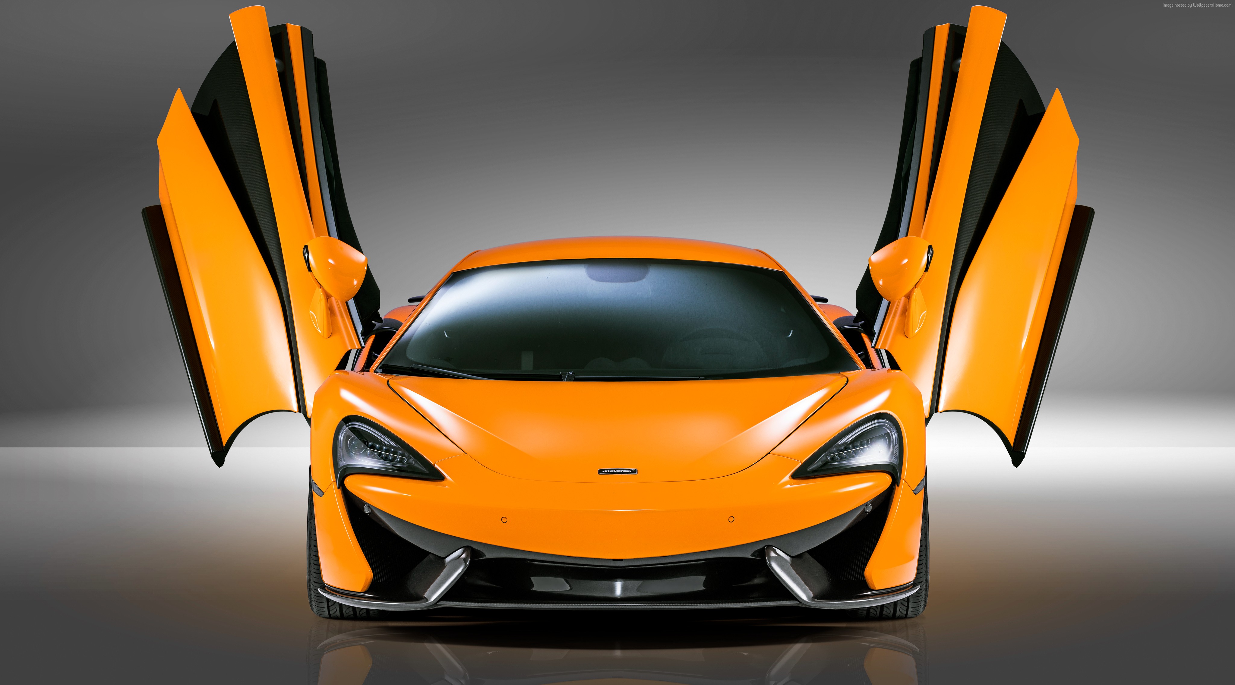 Orange McLaren 570S with doors open HD Wallpaper