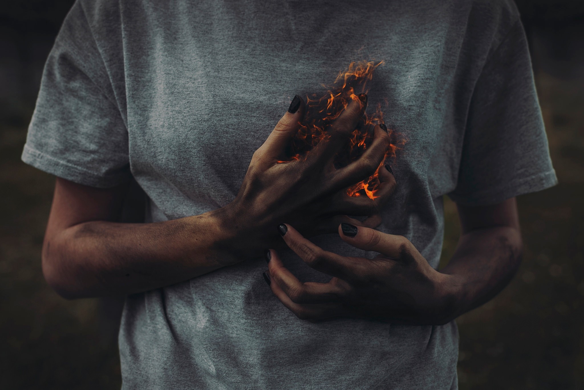 Person holding hands engulfed in flames HD Wallpaper