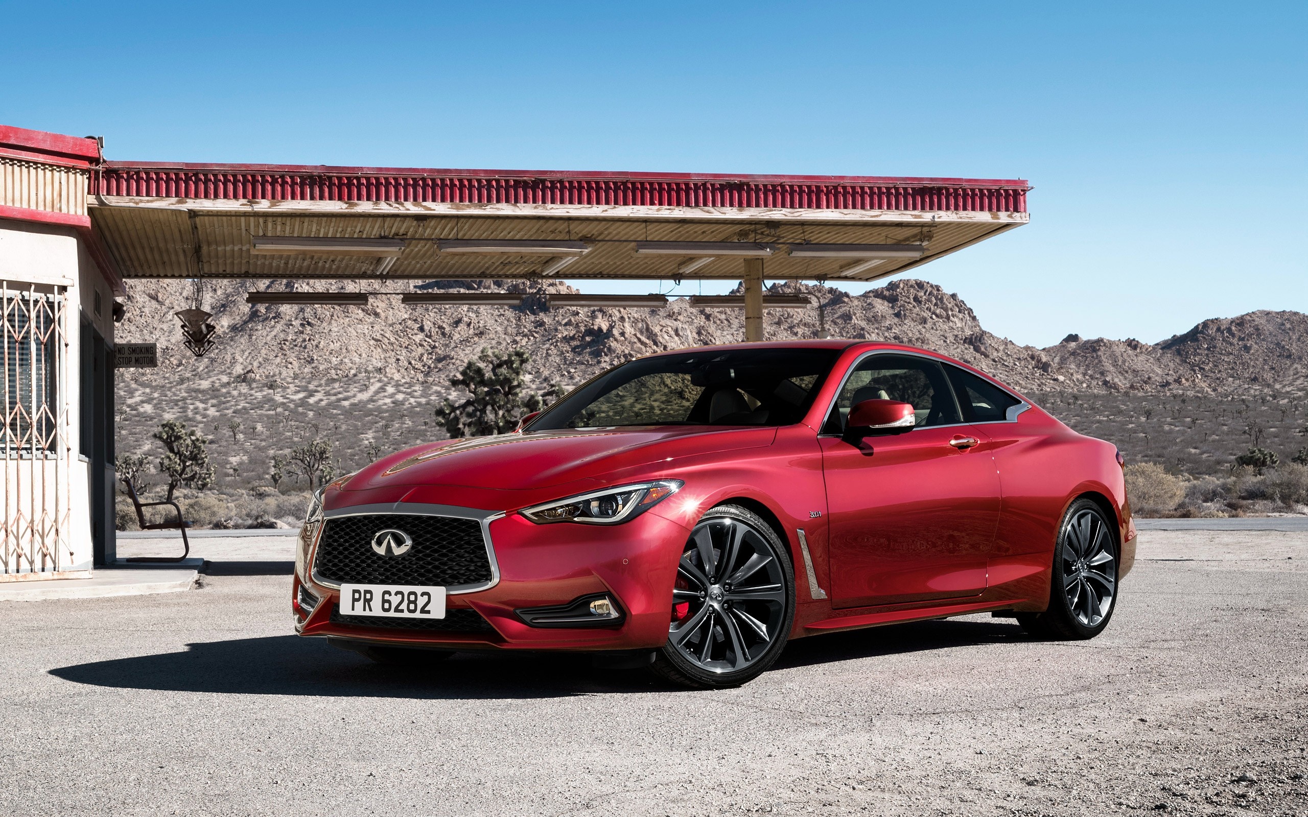 Red Infiniti Q60 Coupe at Desert Gas Station HD Wallpaper
