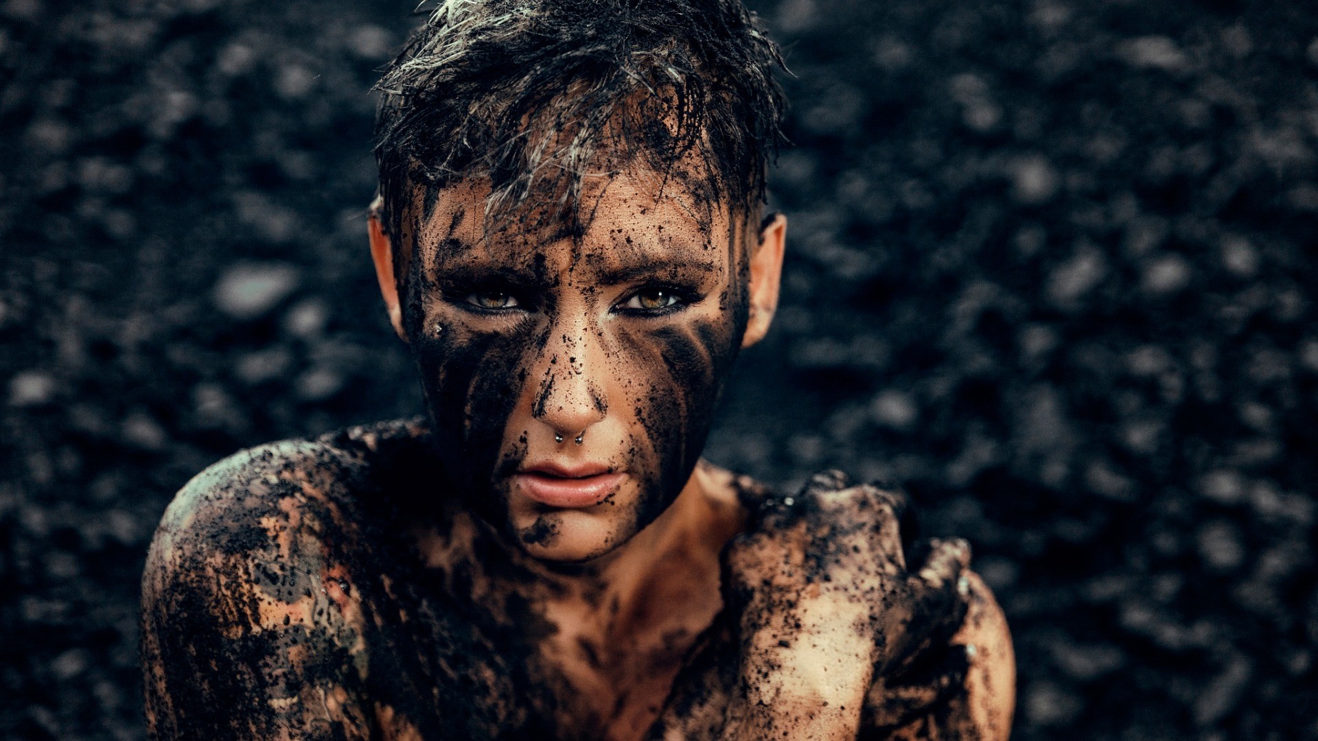 Woman covered in mud, close-up portrait HD Wallpaper