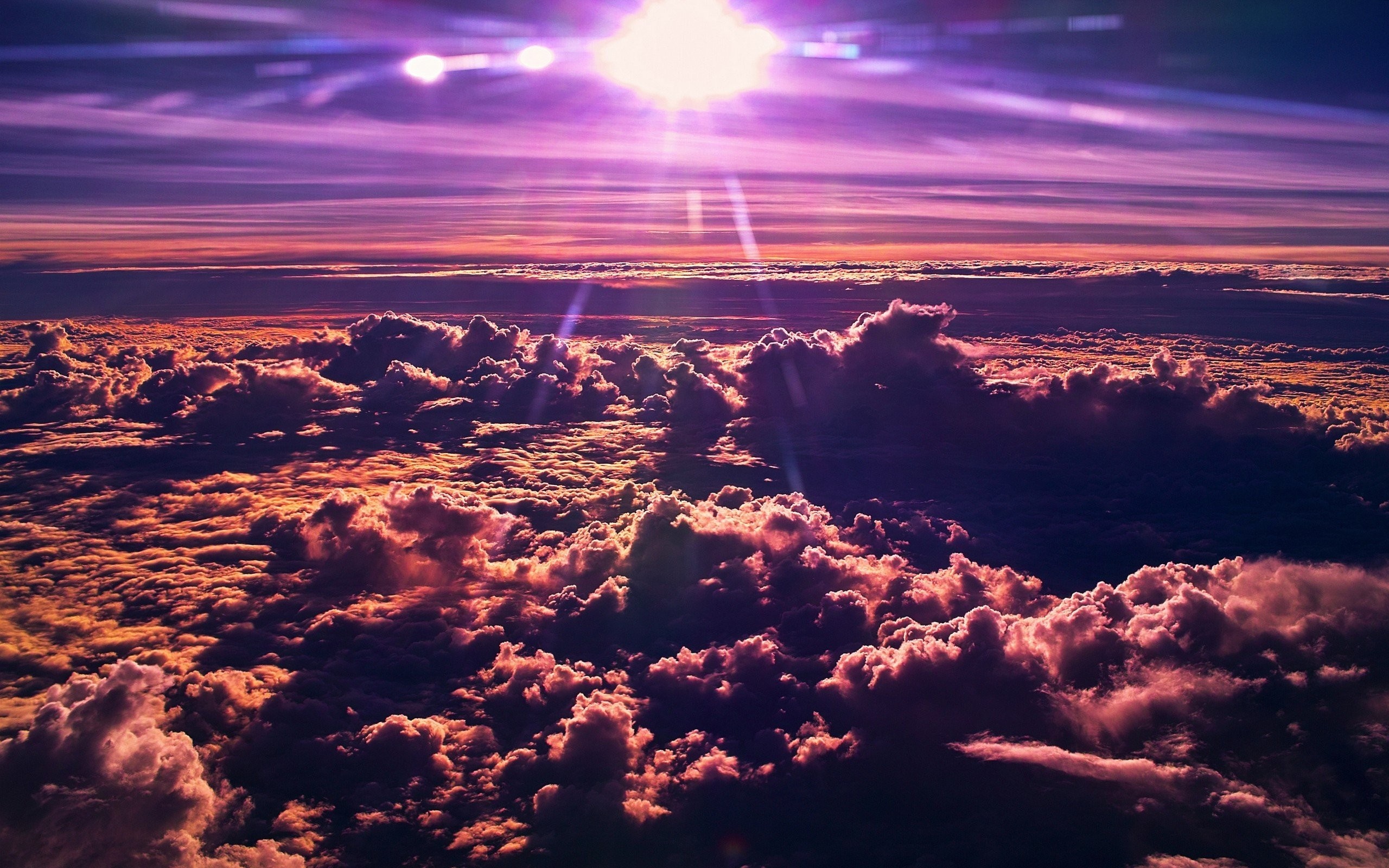 Sunlight over clouds at sunset HD Wallpaper