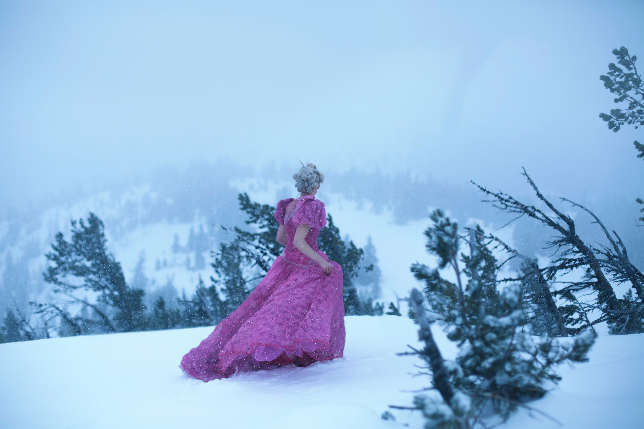 Woman in a pink dress in a snowy landscape HD Wallpaper
