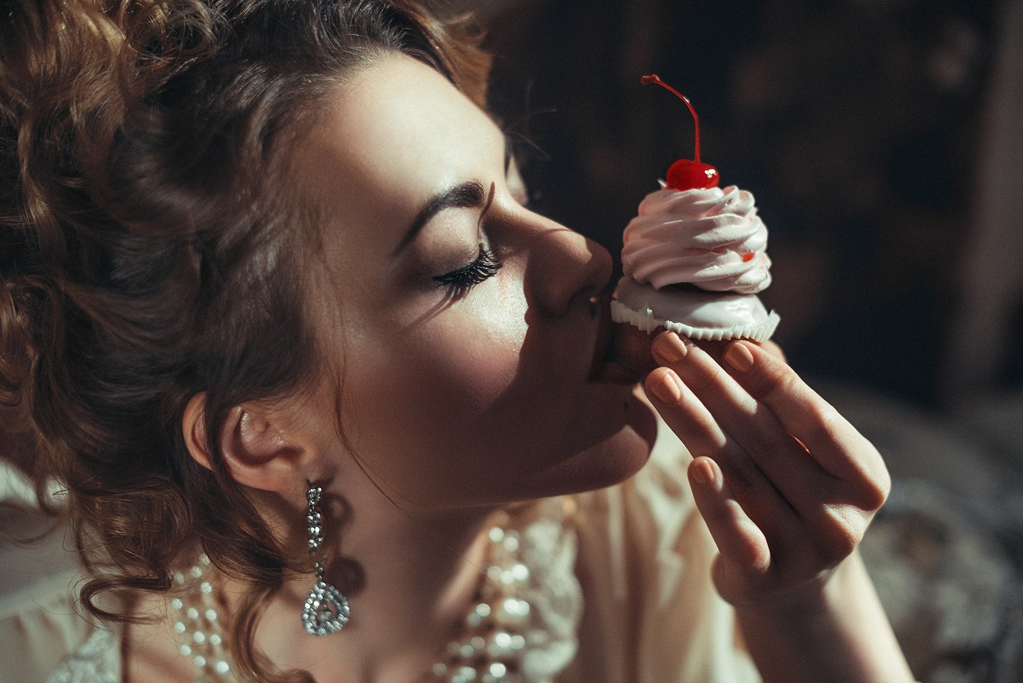 Woman with cupcake and cherry HD Wallpaper