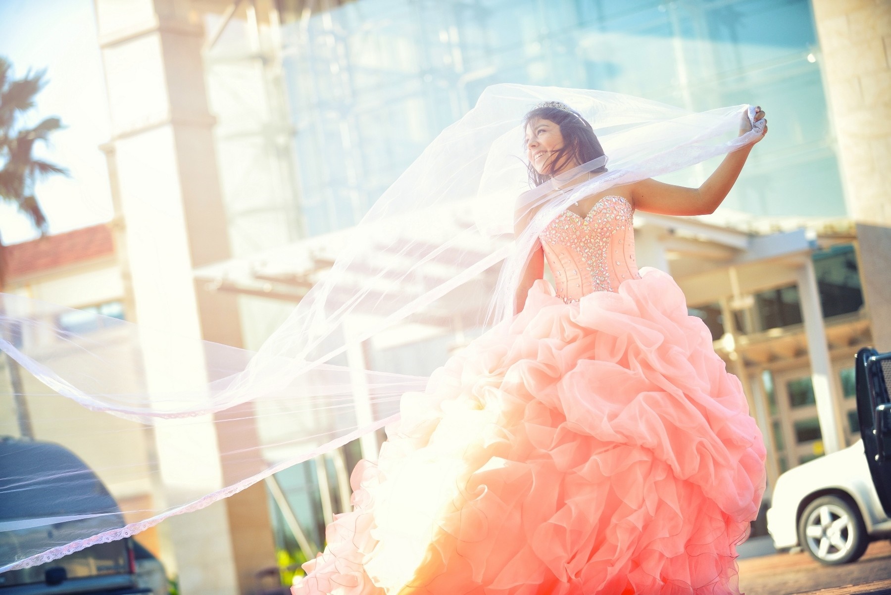 Woman in a pink quinceañera dress with a veil HD Wallpaper