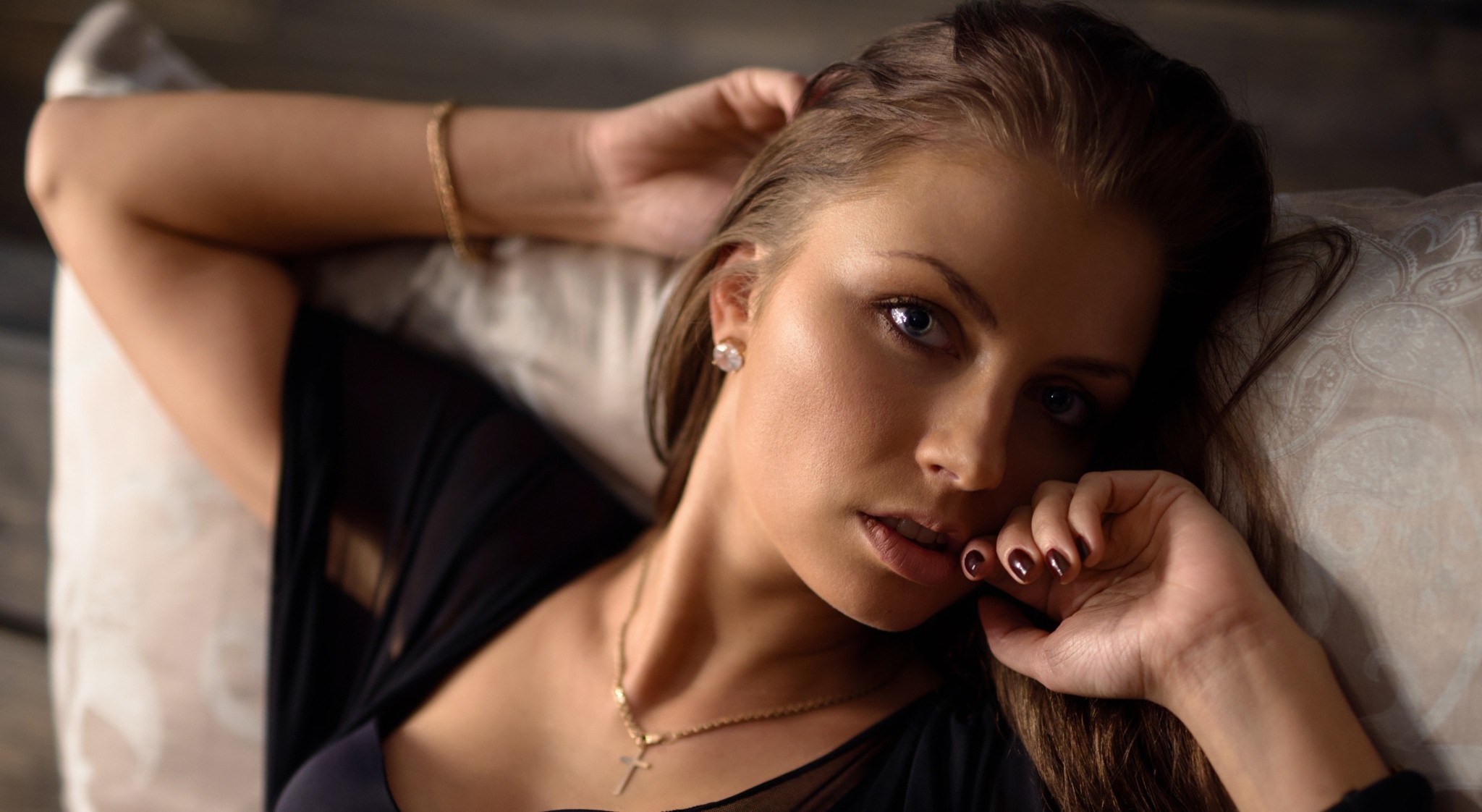 Woman with long brown hair wearing a black top and necklace HD Wallpaper