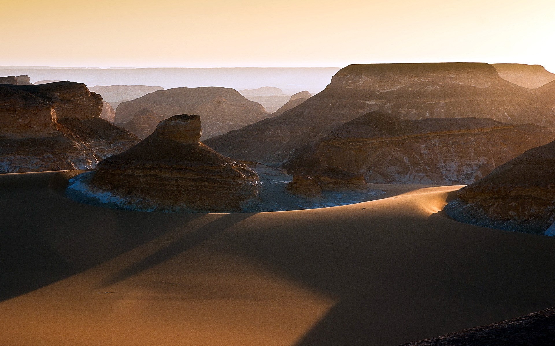 Desert landscape with rock formations and sand dunes HD Wallpaper