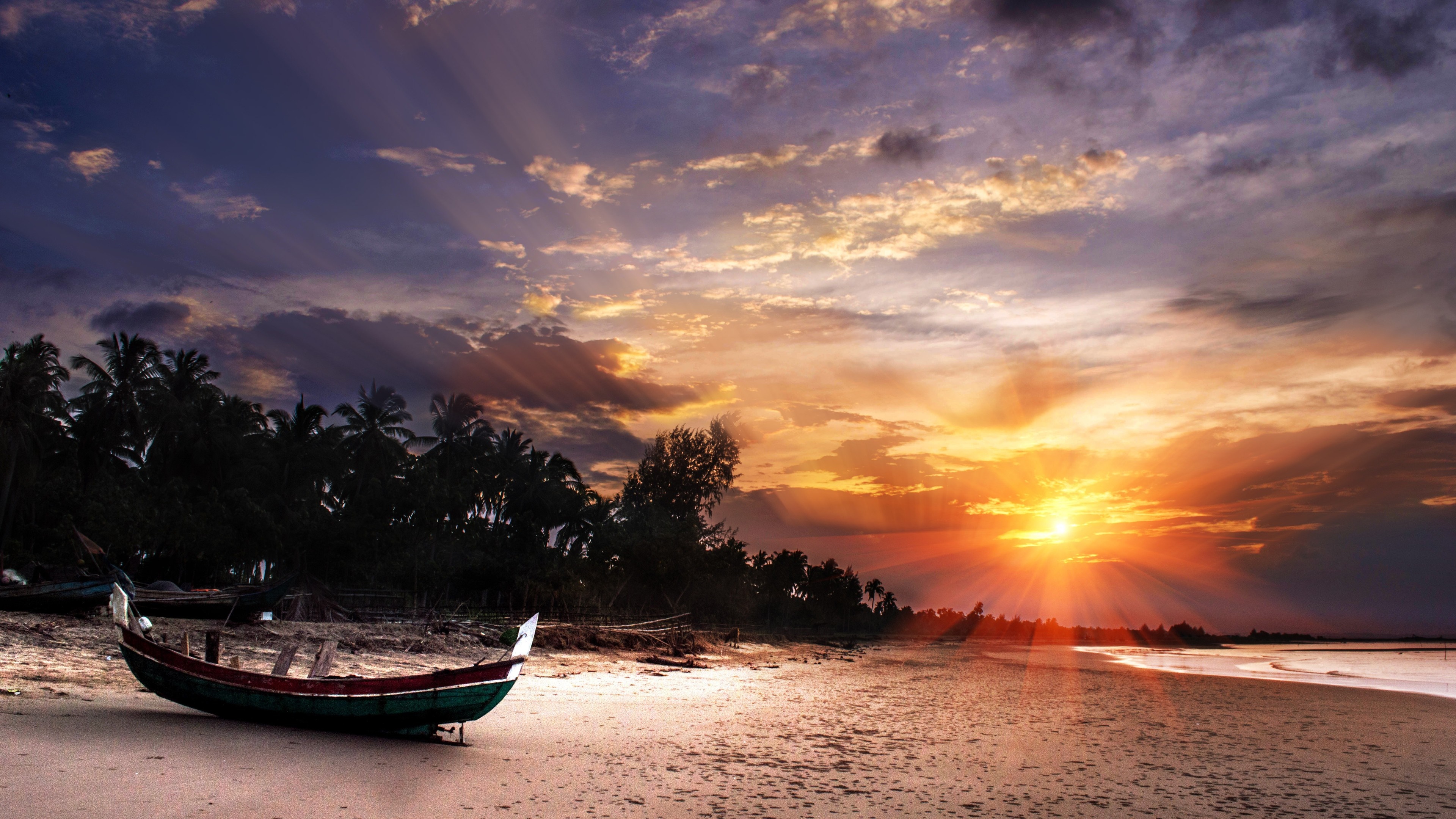 Boat on a beach at sunset with palm trees HD Wallpaper