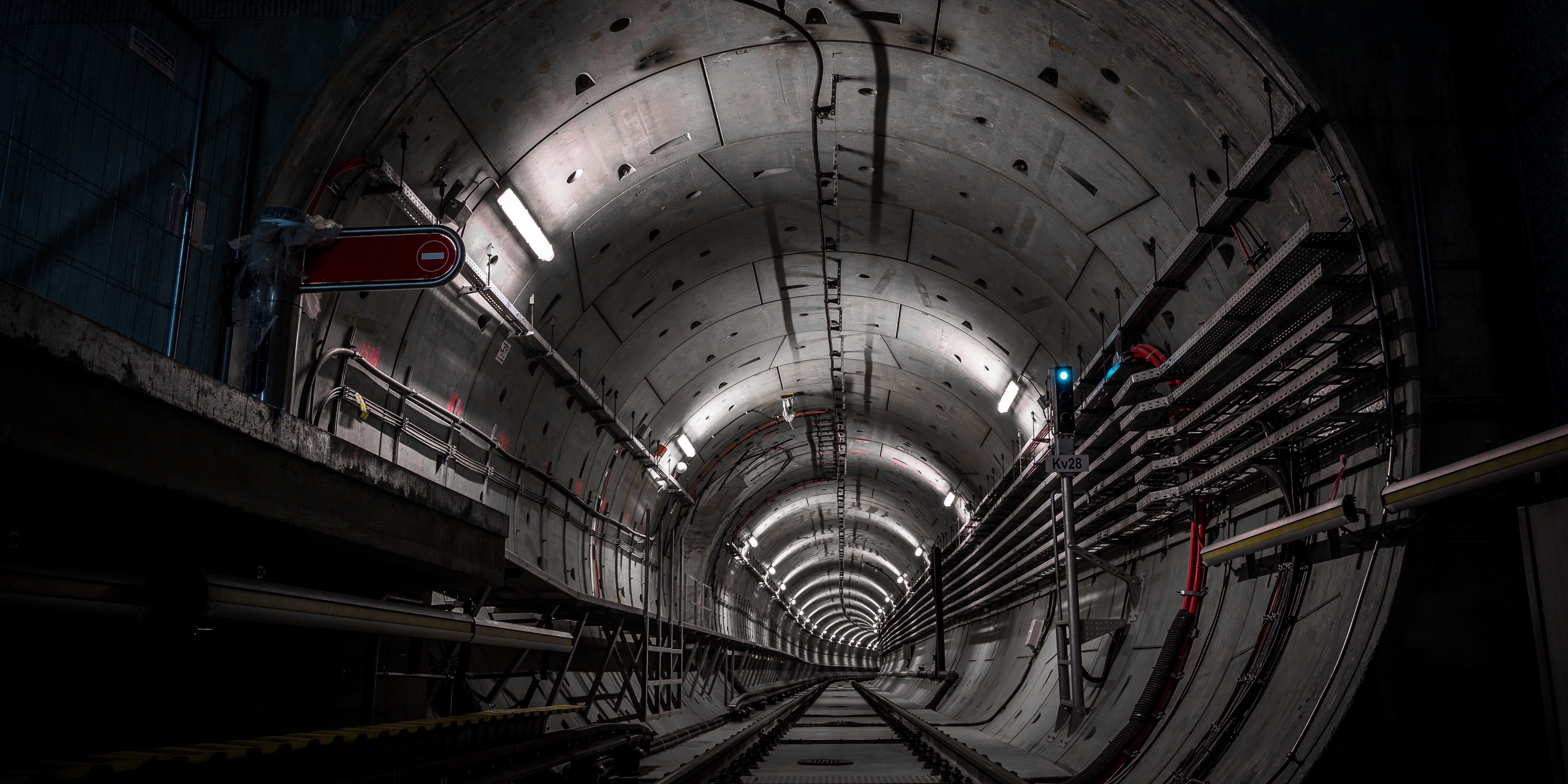 Concrete tunnel with railway tracks and lights HD Wallpaper