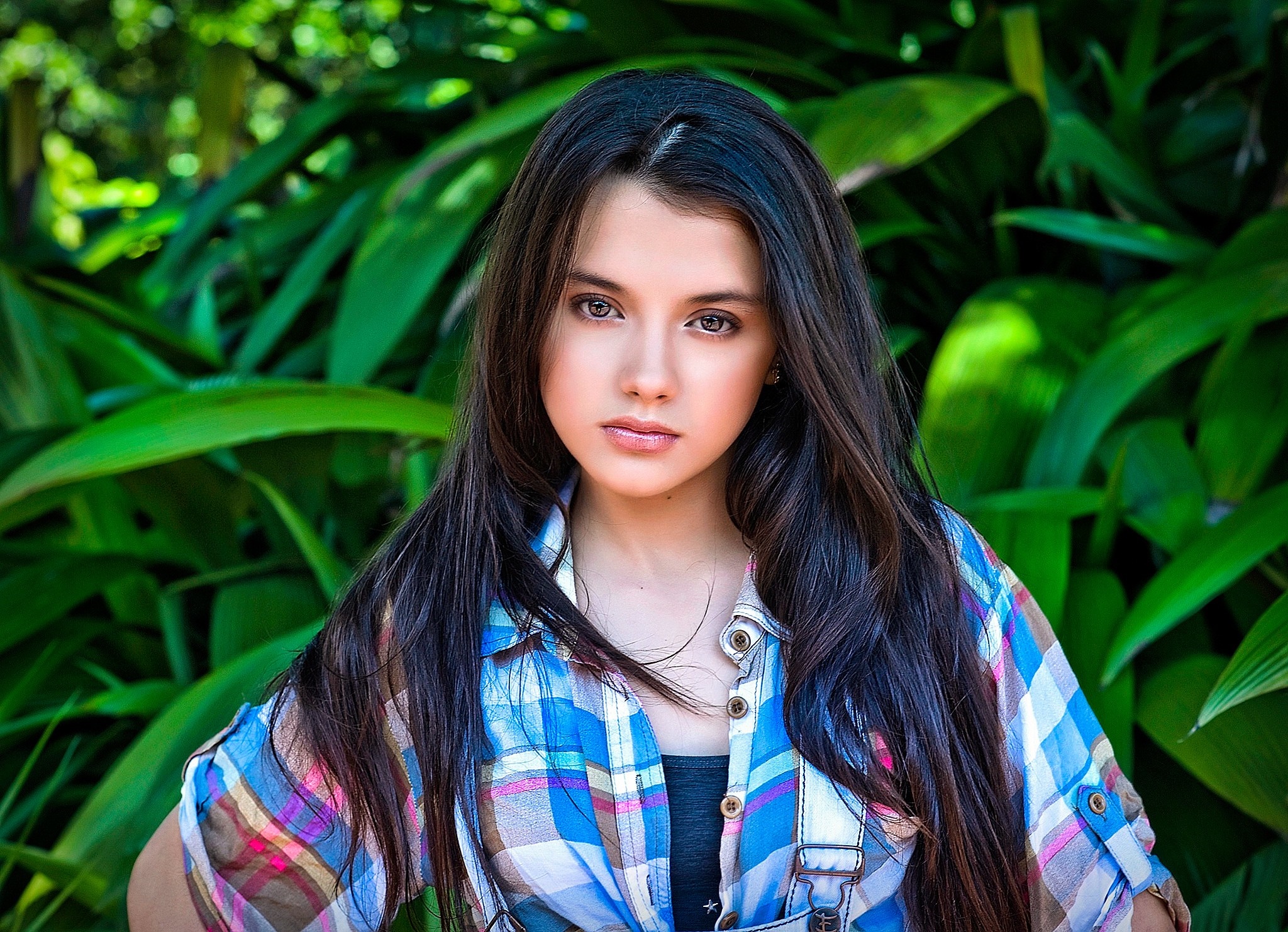 Young woman in plaid shirt in nature HD Wallpaper