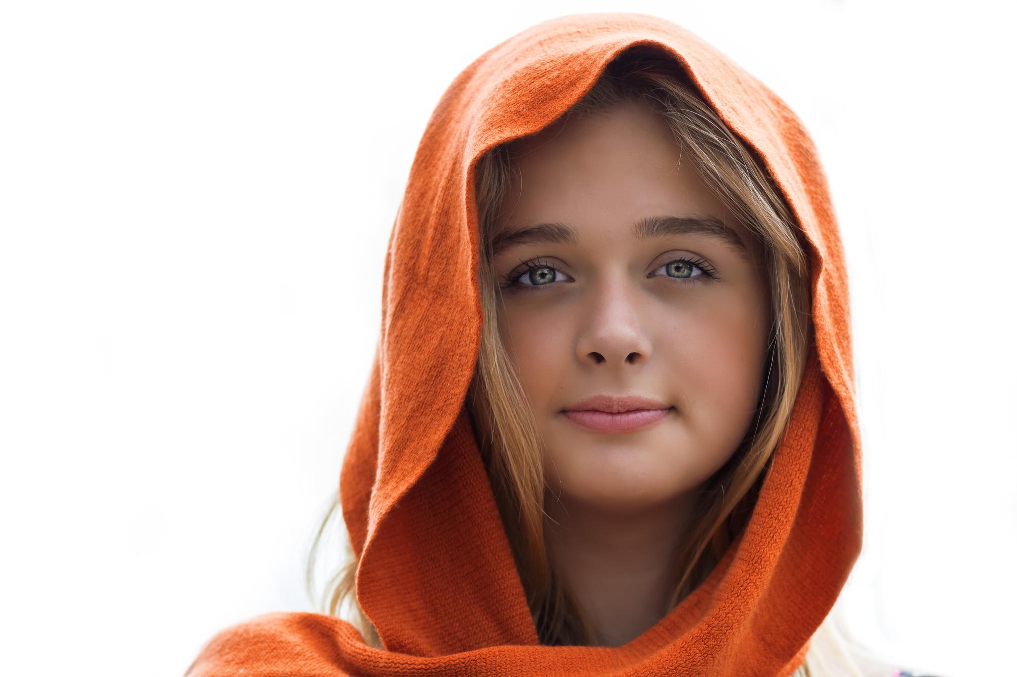 Young woman with blonde hair wearing an orange hood HD Wallpaper