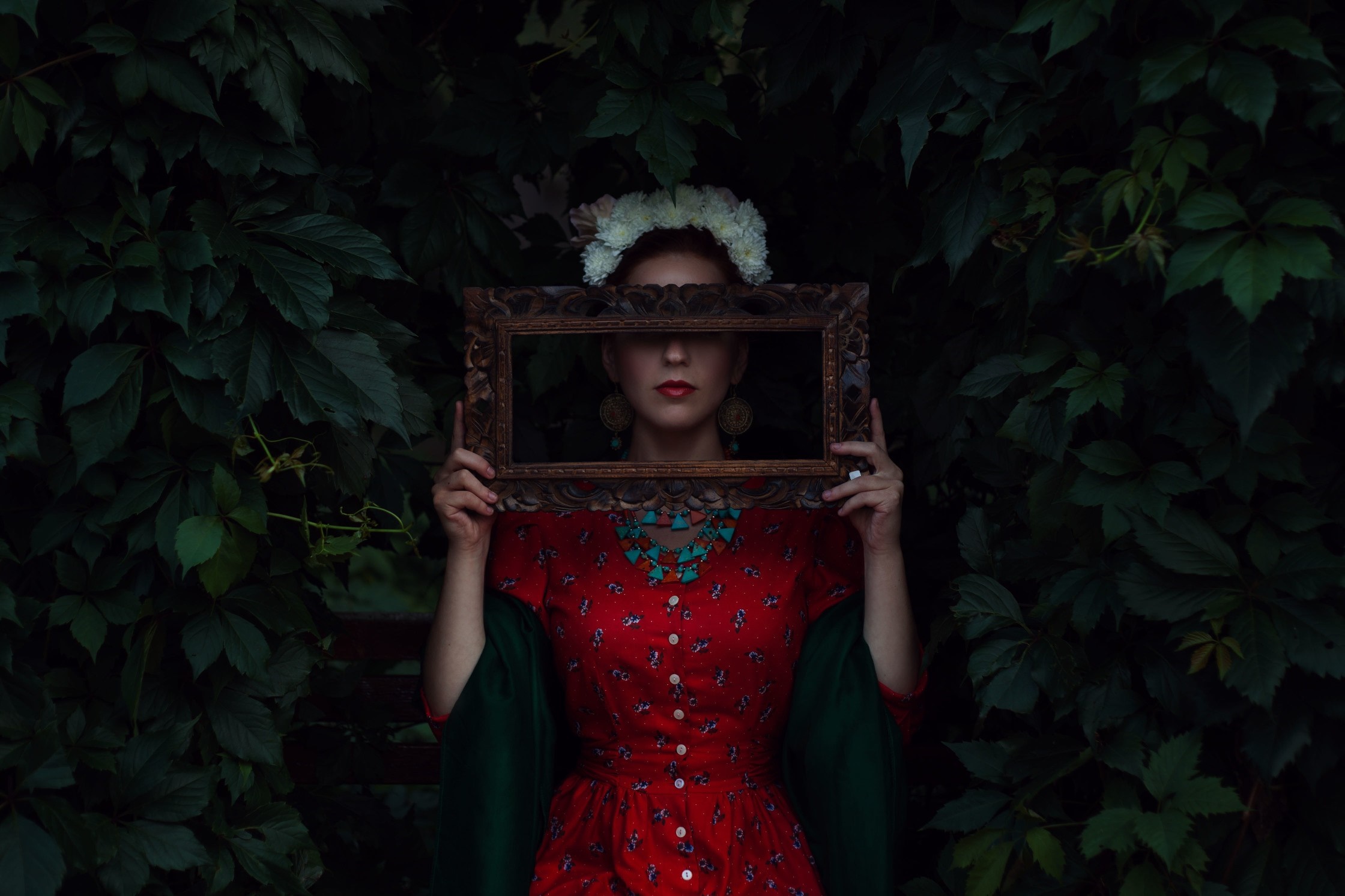 Woman in red dress holding a picture frame HD Wallpaper