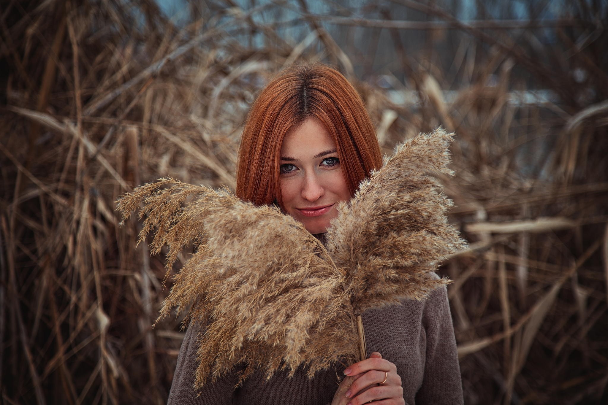 Woman with red hair holding reeds HD Wallpaper